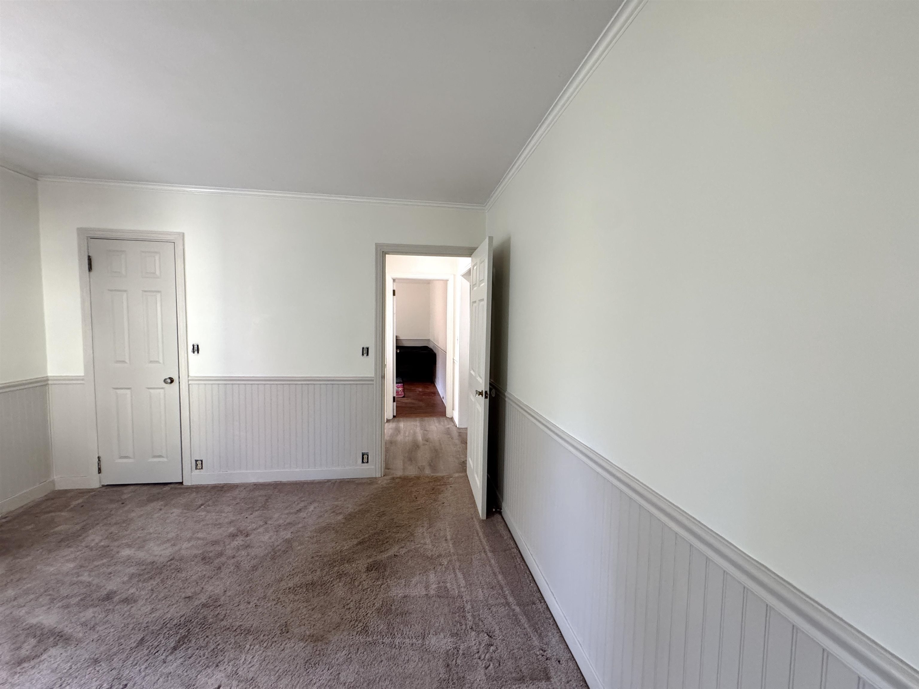 Spacious bedroom with clean neutral finishes