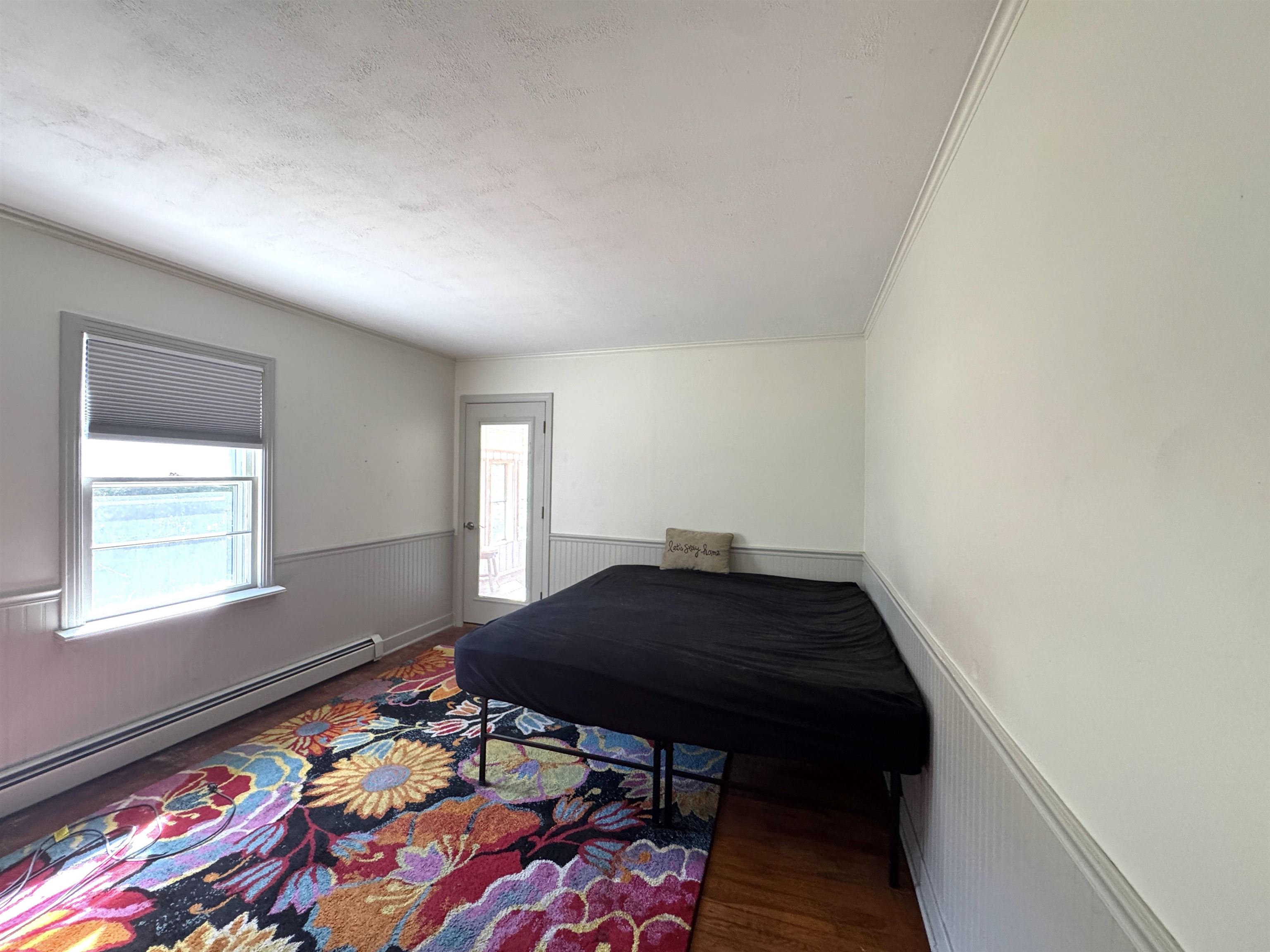Bright and airy bedroom with direct access to the sunroom