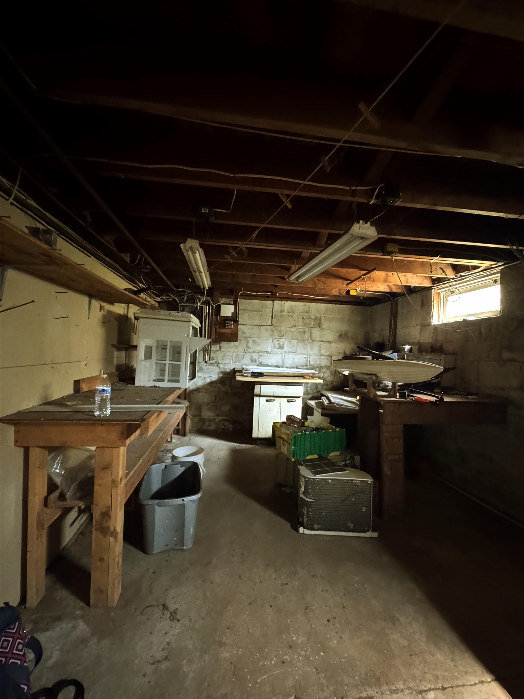 Large basement workshop with built-in benches and ample storage