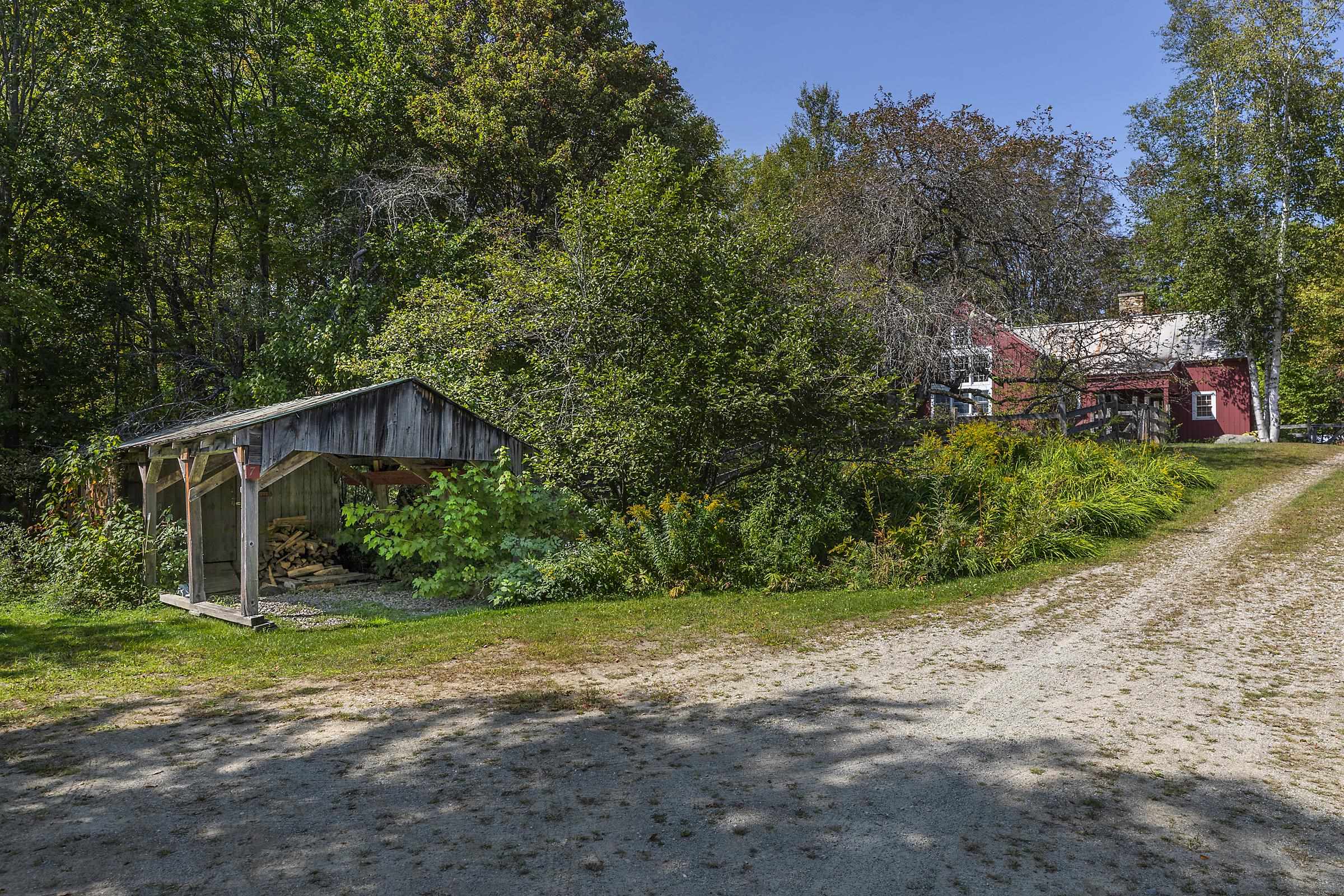 Approaching the House - Drive and Parking Area with Shed and Carport