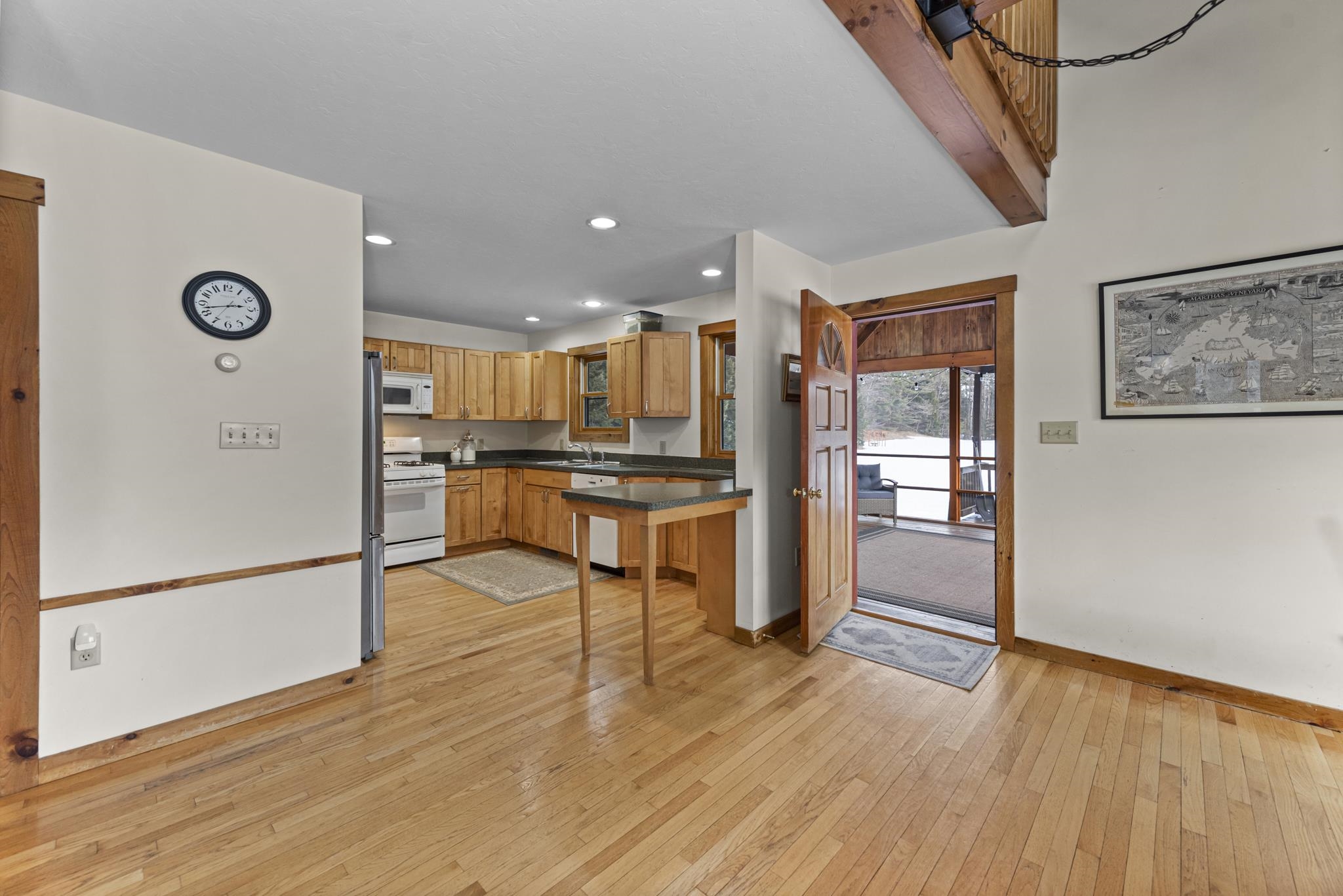 The screened in porch is right off the kitchen
