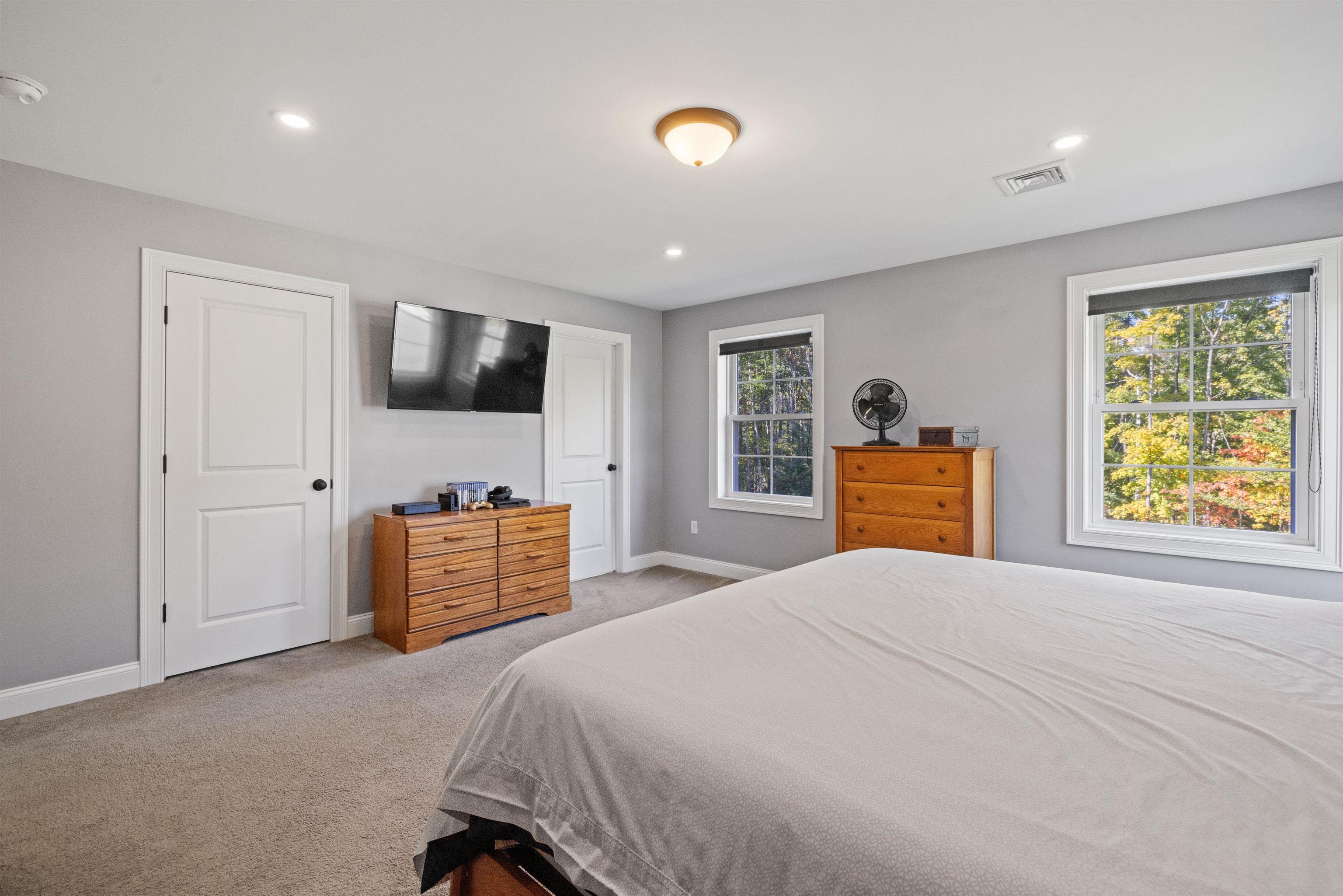 another view of Primary suite - bathroom is door on right, walk in closet is door on left