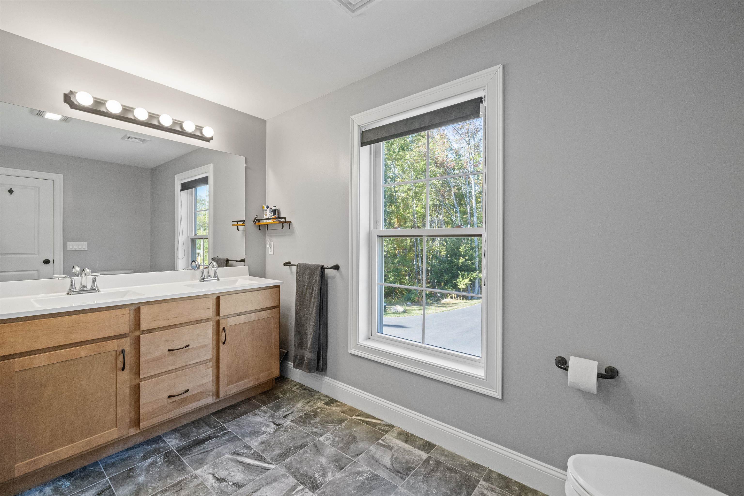 Primary bedroom attached full bathroom, with double sinks