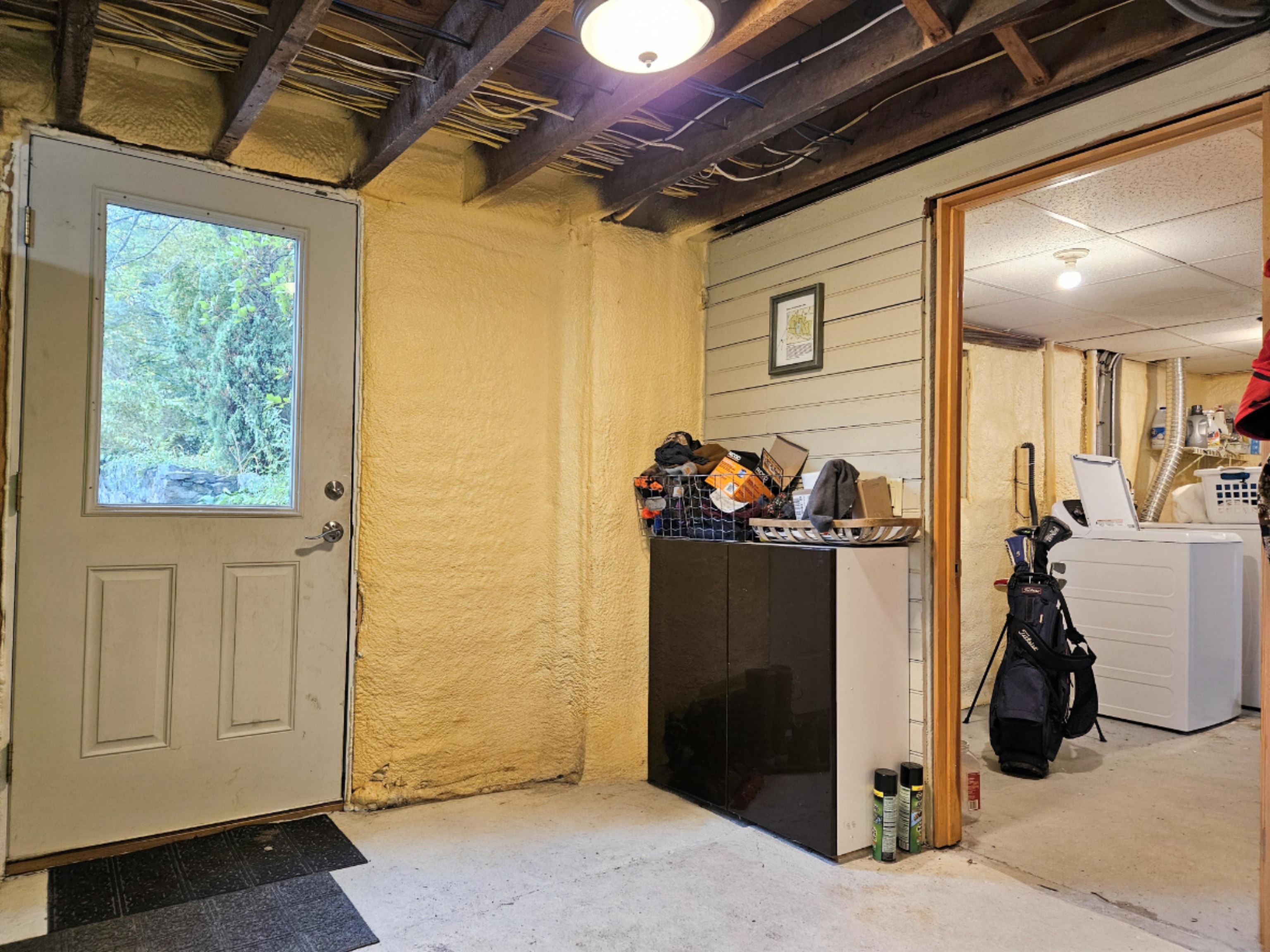 Partially finished walk-out basement for a mudroom & exercise area