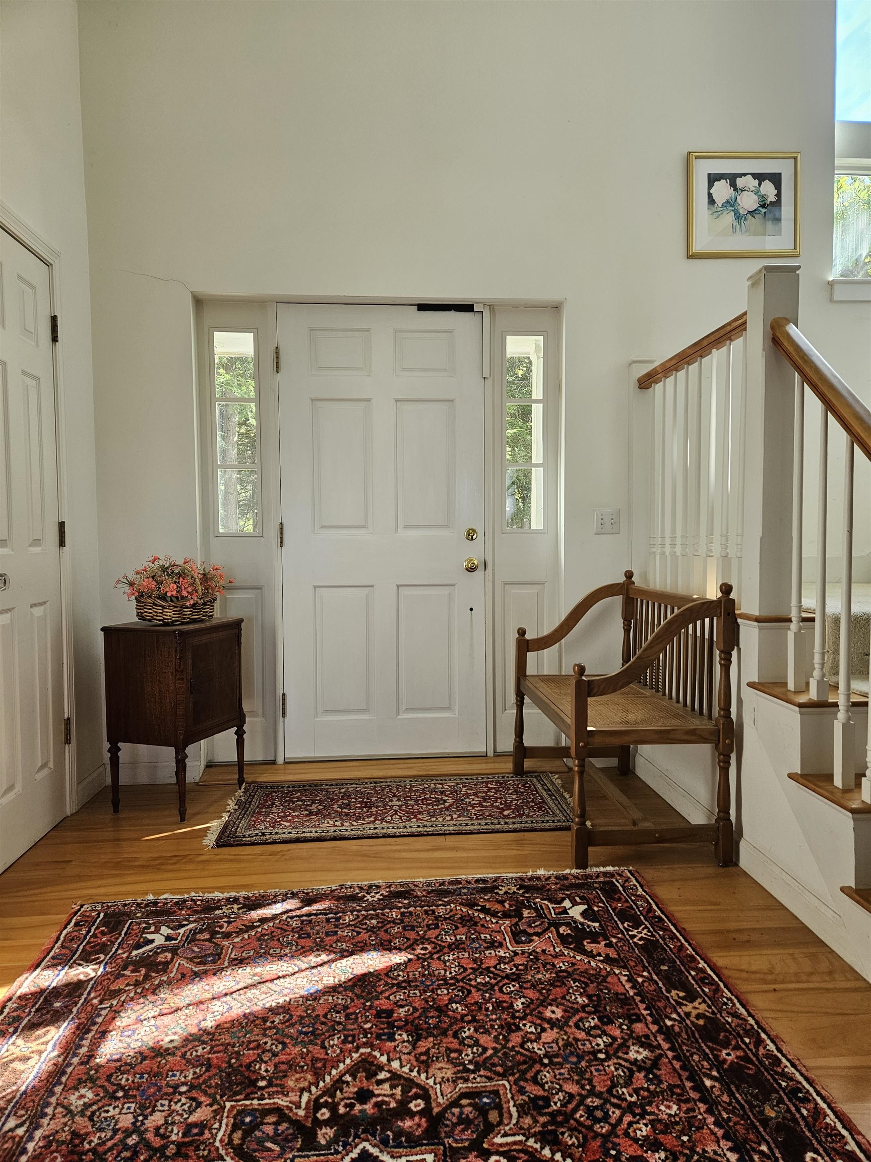 Elegant front foyer with cathedral ceiling