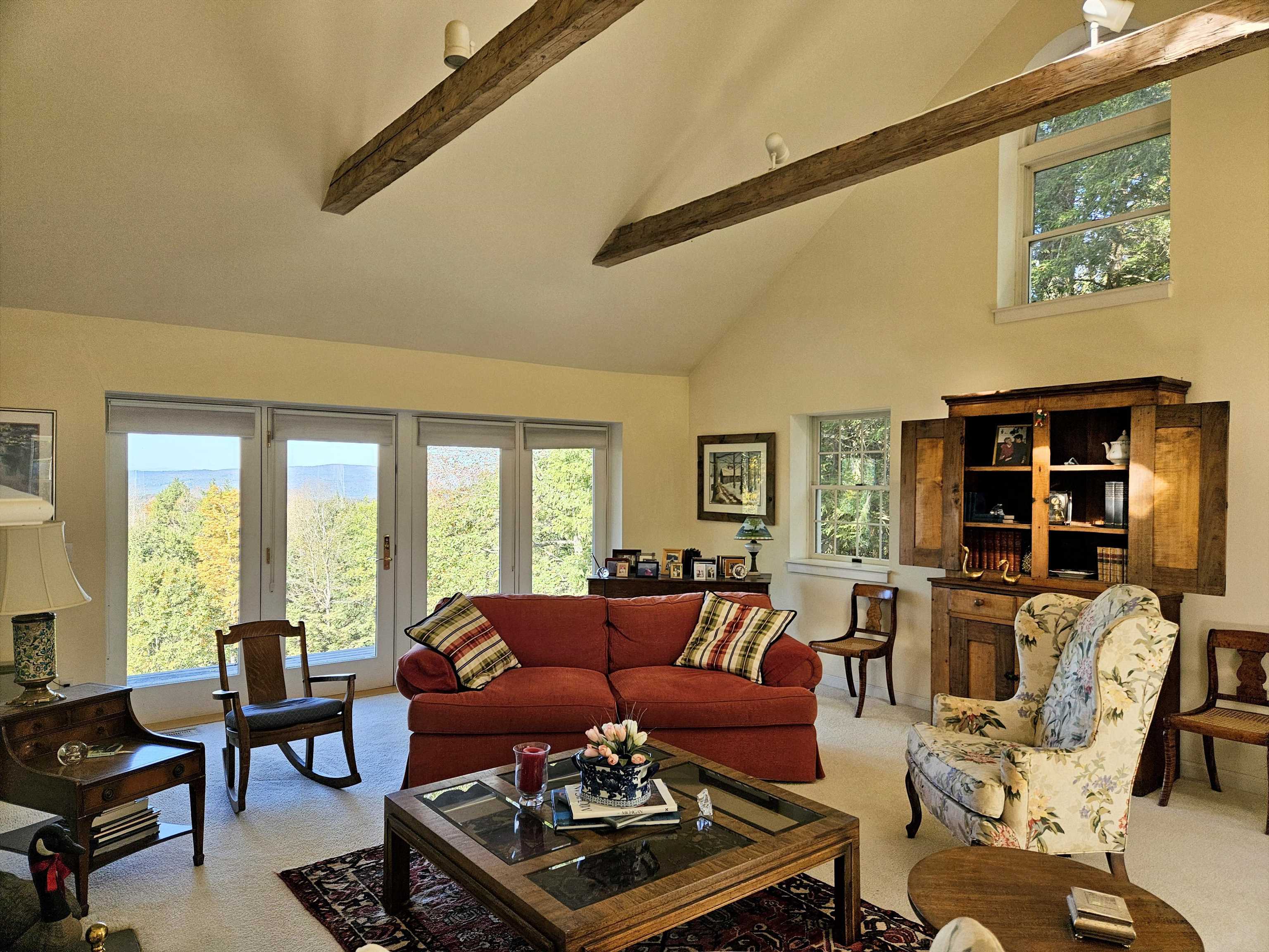 Fabulous living room with long range views,brick fireplace & cathedral ceiling