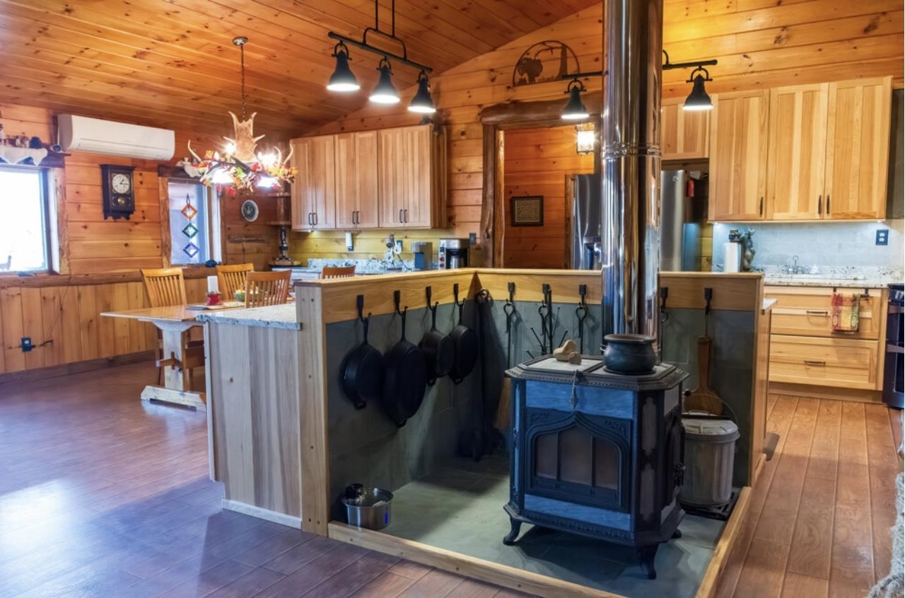 Soapstone Wood Stove Looking into Dinning and Kitchen area 24183035