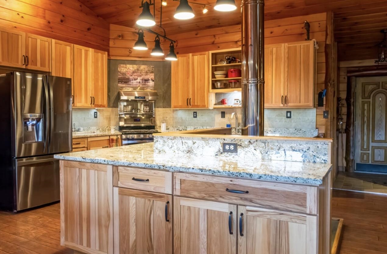 Kitchen Featuring L-Shaped Island with Storage 24183032