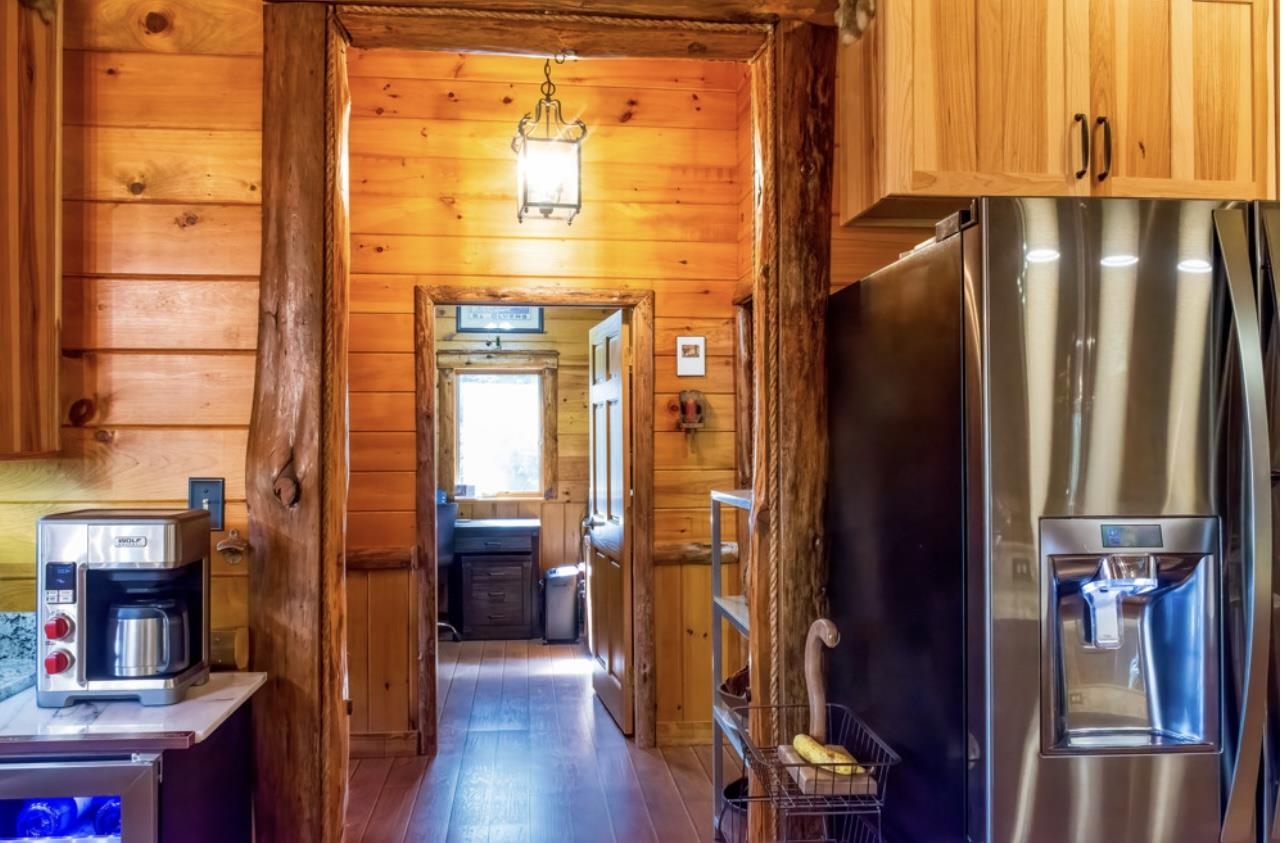 Door to The Primary Suite Between Kitchen and Dining Area 24183021