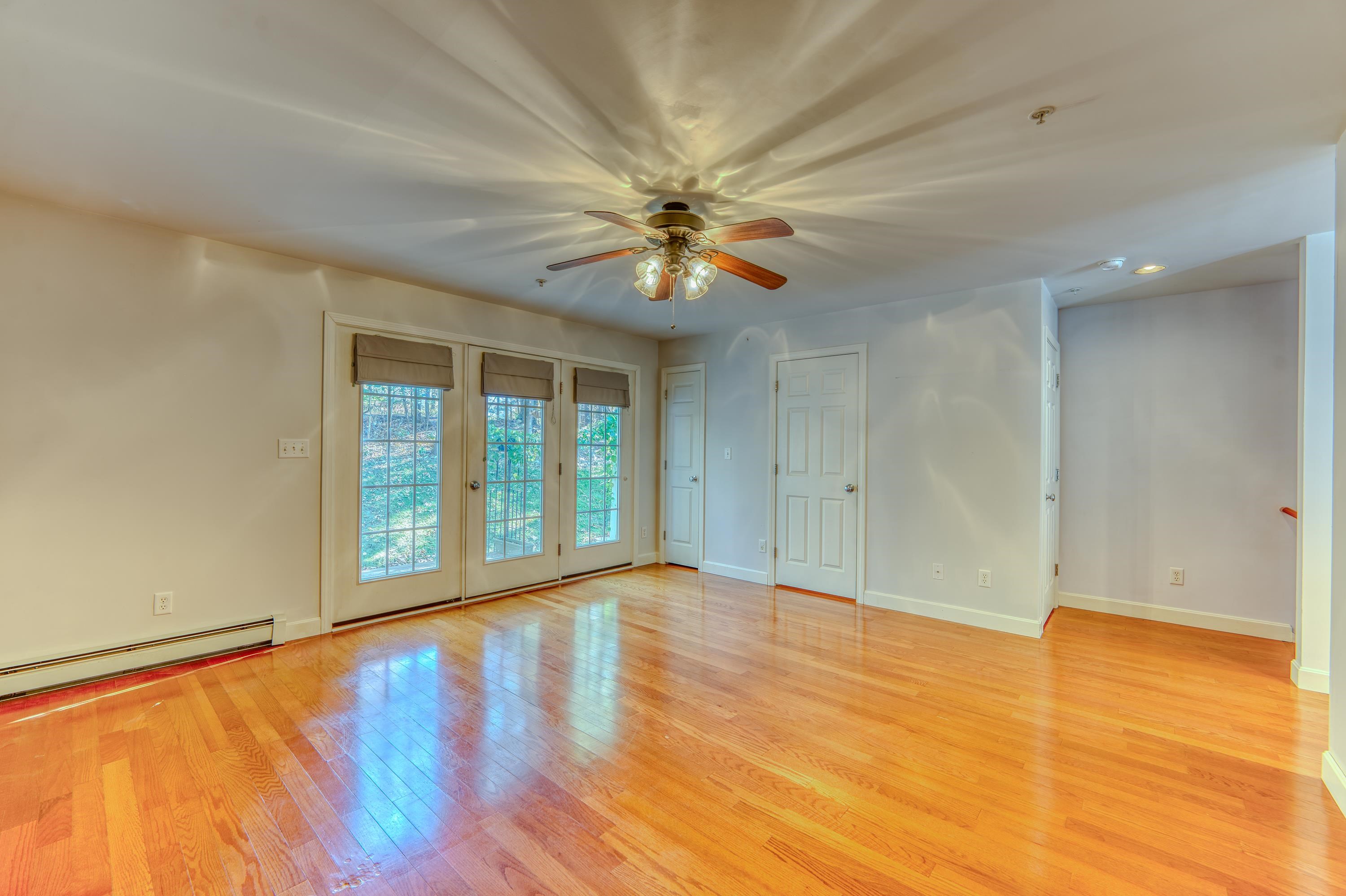 Living room w/ French door to the deck