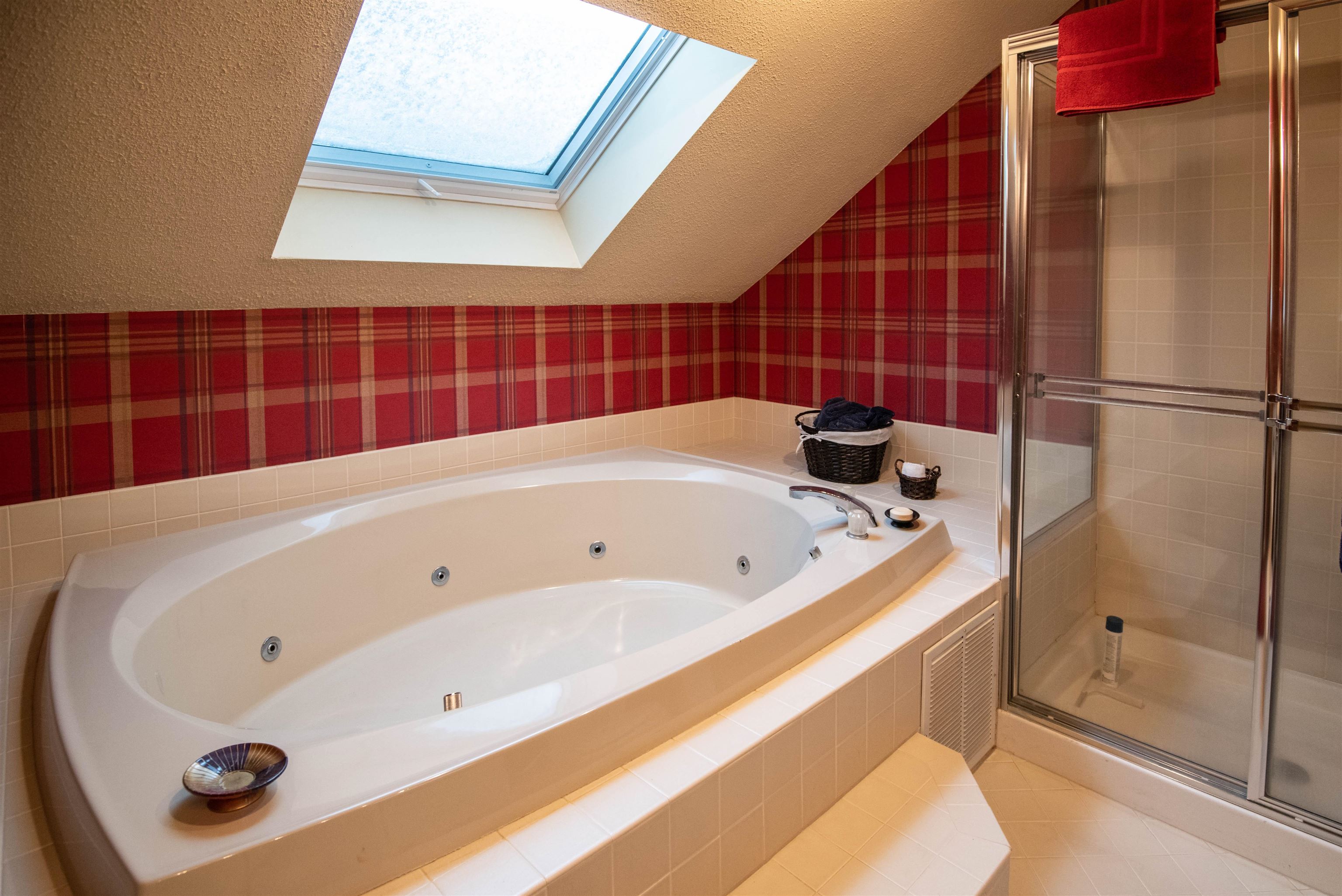 Skylit whirlpool tub for apres ski soaking. 21086167