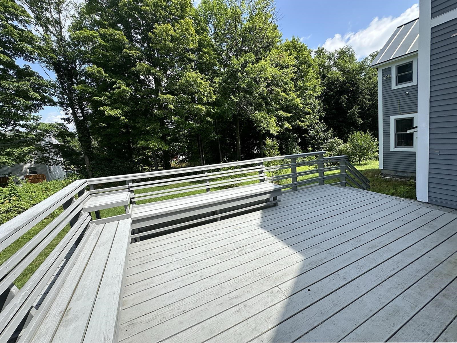 Huge back deck overlooking lush gardens 21962945