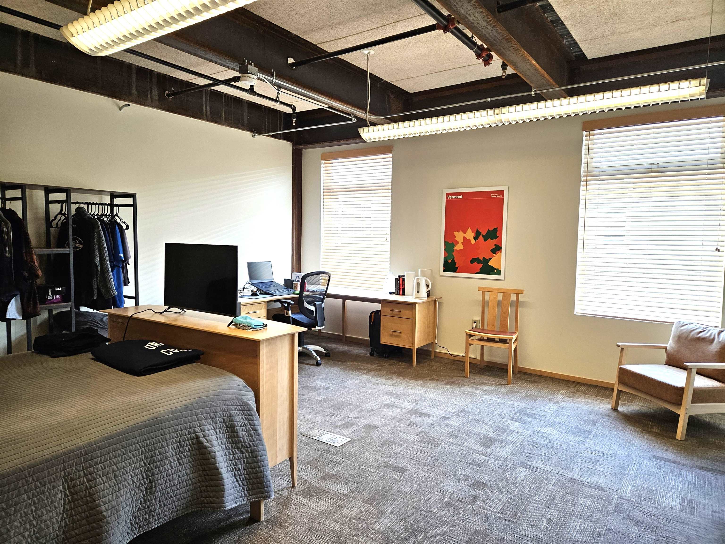 First of six bedrooms with large windows & hardwood floors