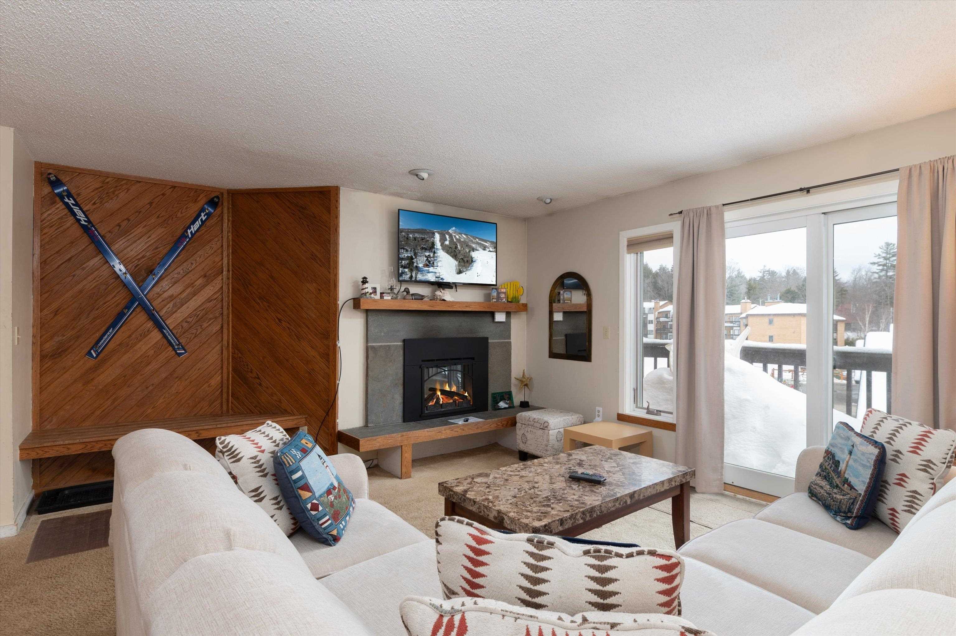 Slider off living room leads to deck overlooking the slopes 22769440