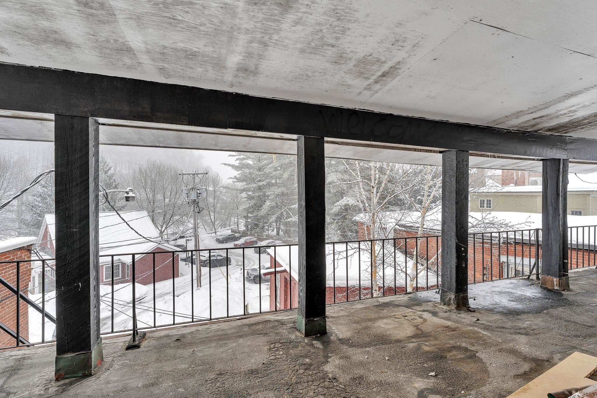 3rd level covered deck overlooking Visitor Center & Kedron Brook