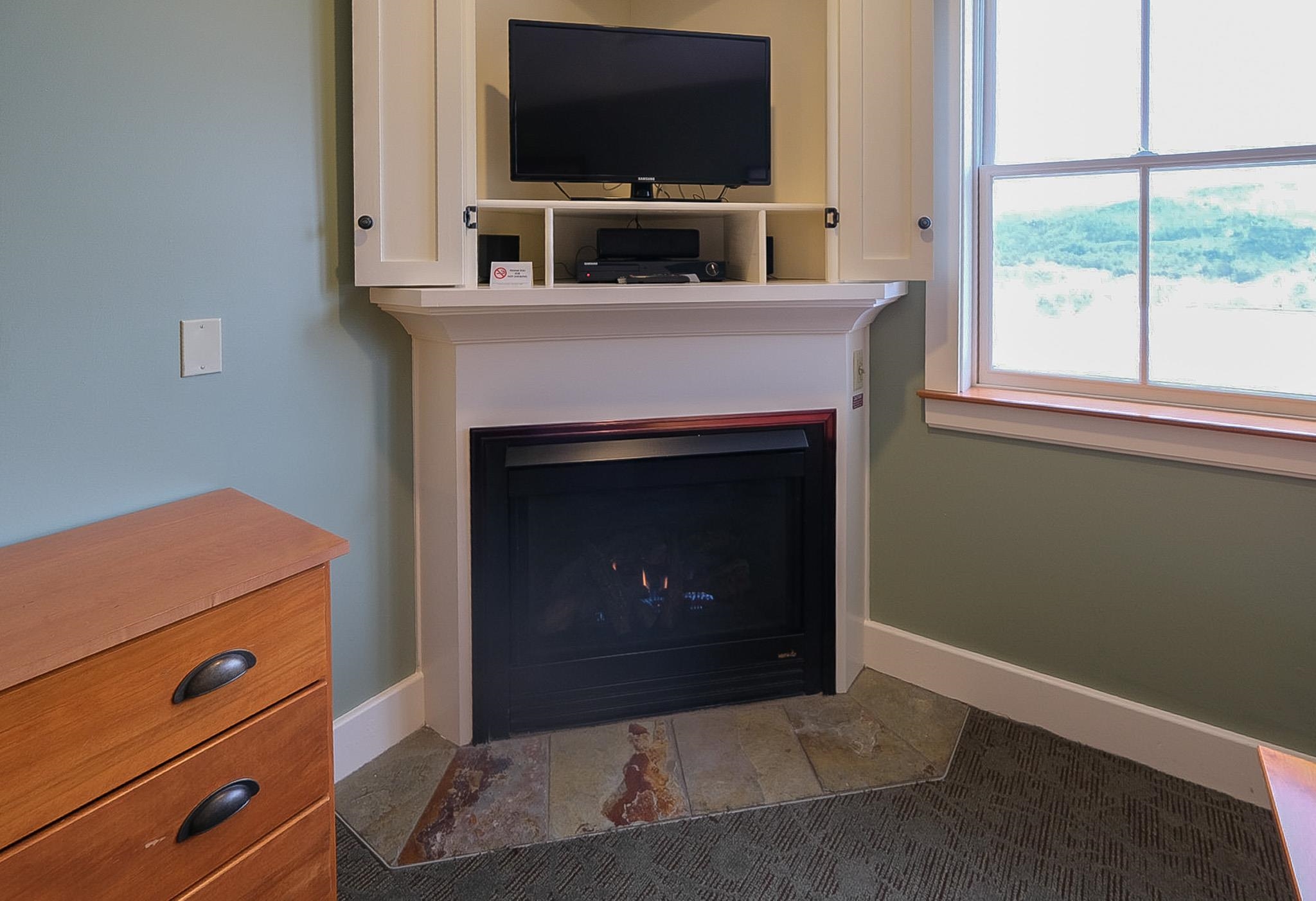 Fireplace and entertainment center in King suite 22804944