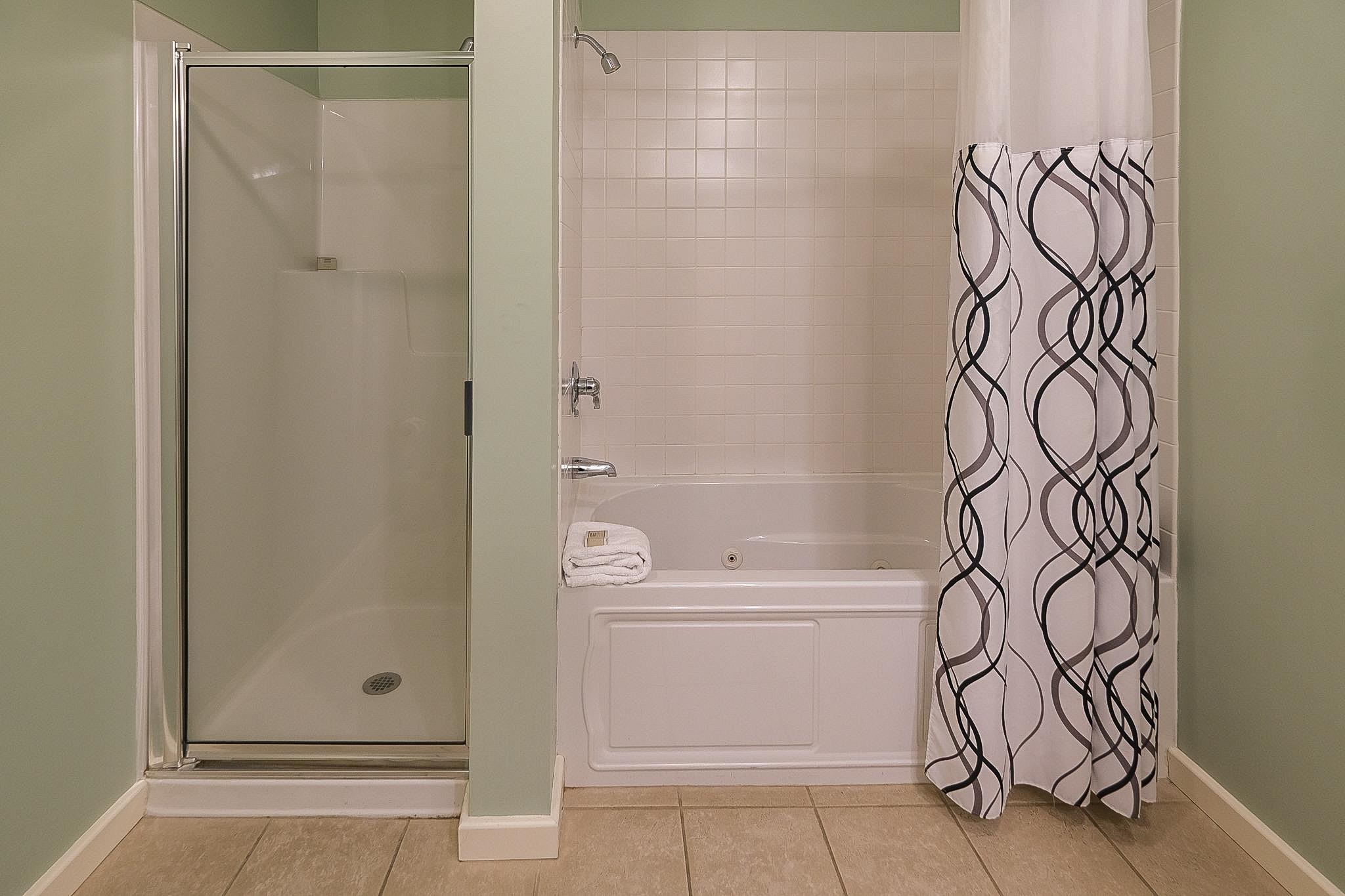 Jetted tub and a shower 22804948