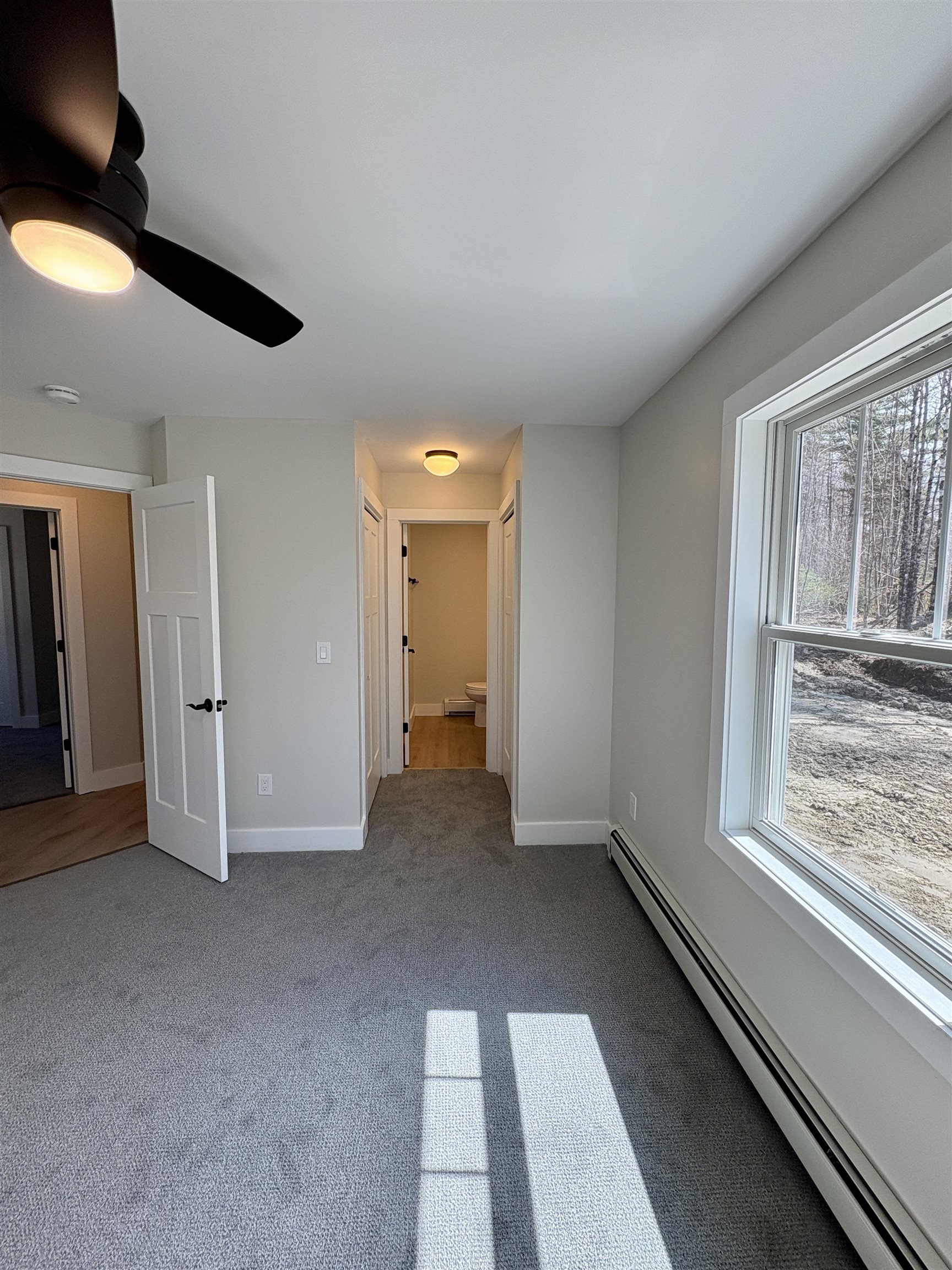 dual closets headed into the ensuite bath 23069389