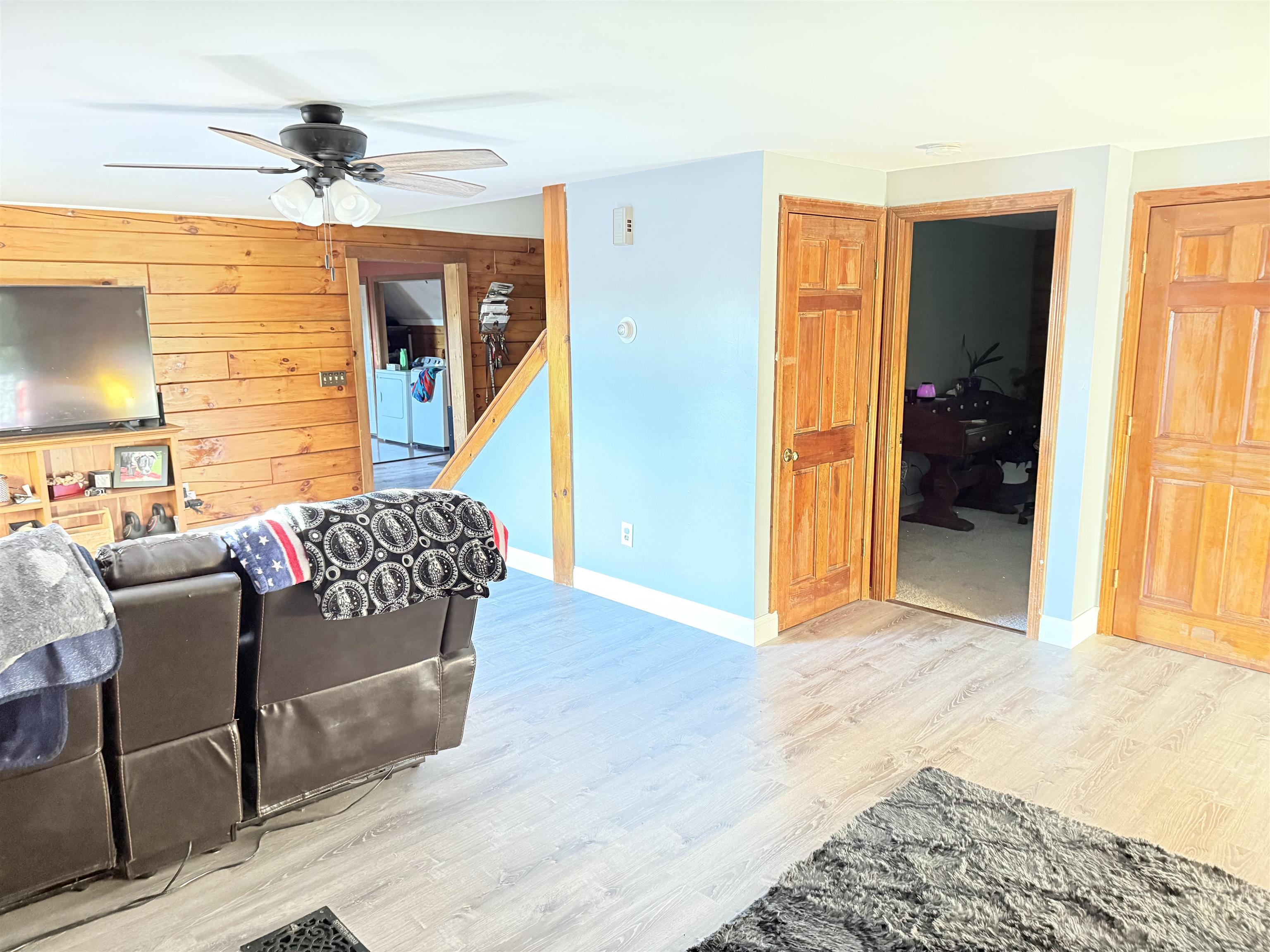 Livingroom w/ door to first floor bedroom