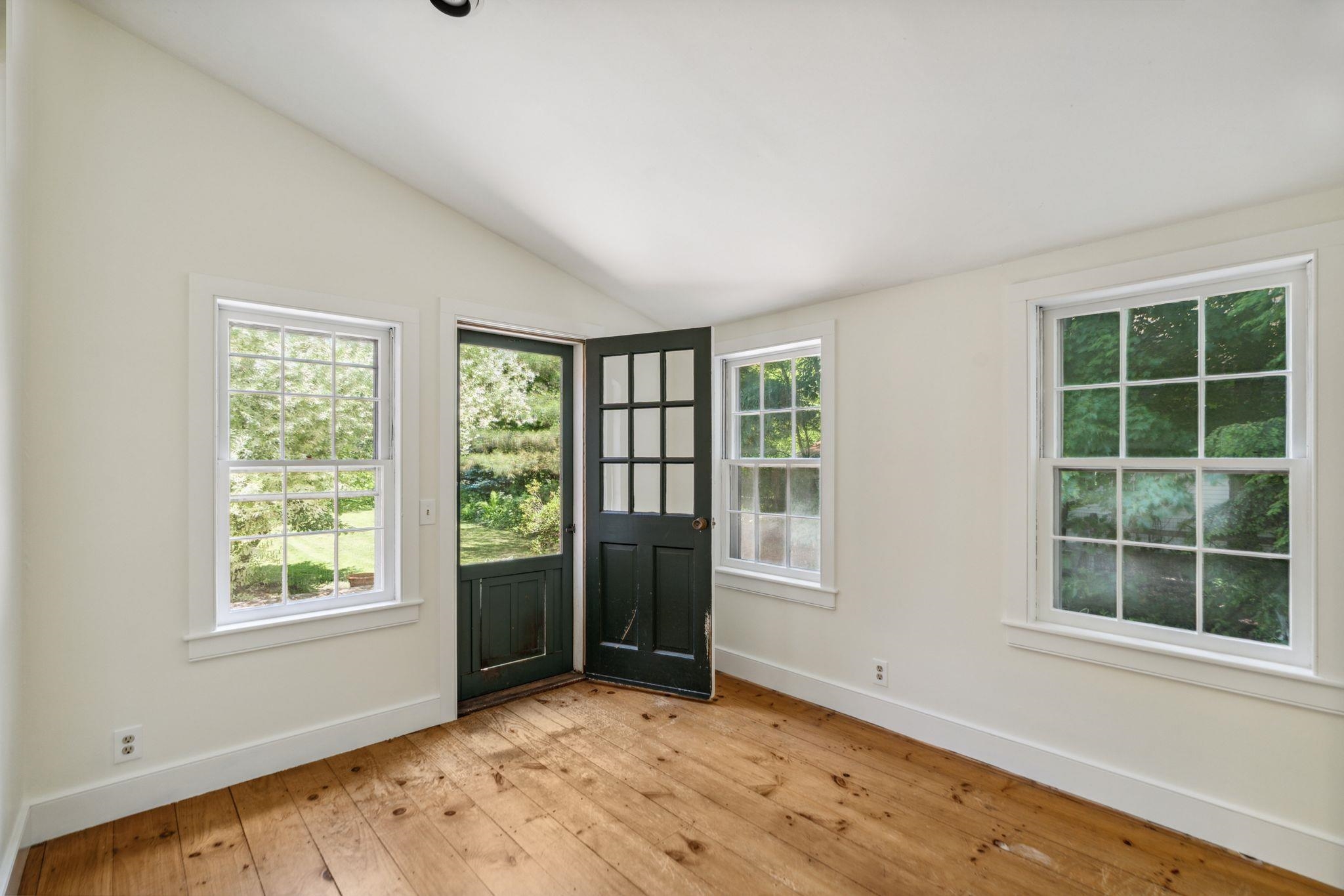 Mudroom in between back yard and living room on first floor