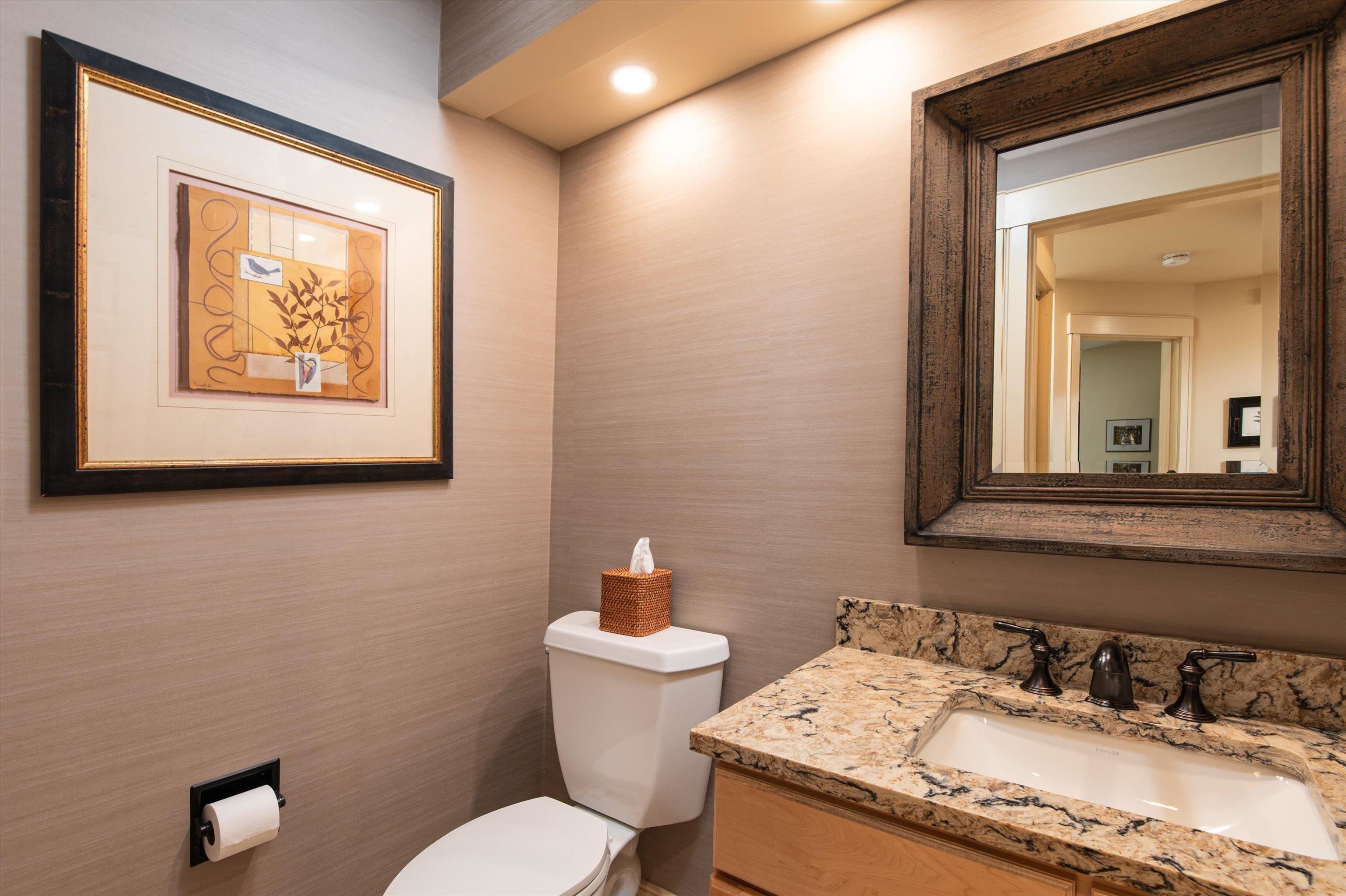 Powder room adjacent to entryway & kitchen 23533977