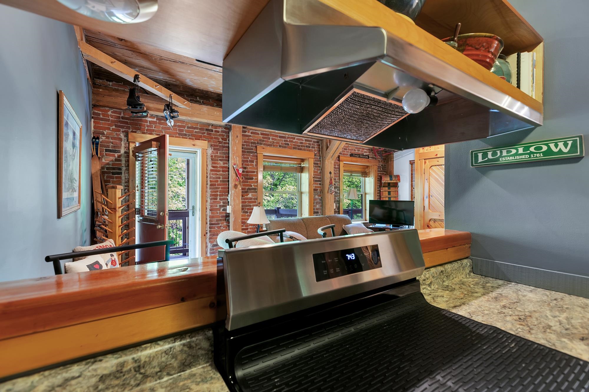 Kitchen and breakfast bar overlook the living area 23302366