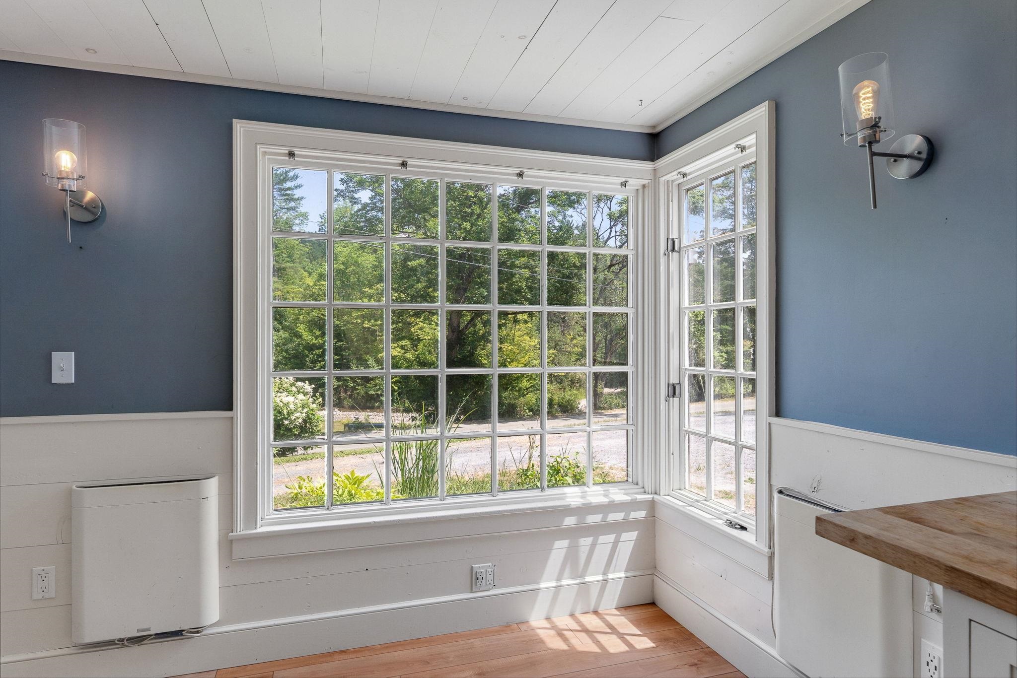 These stunning east facing windows look out towards the Private Brook on the property. 23714514
