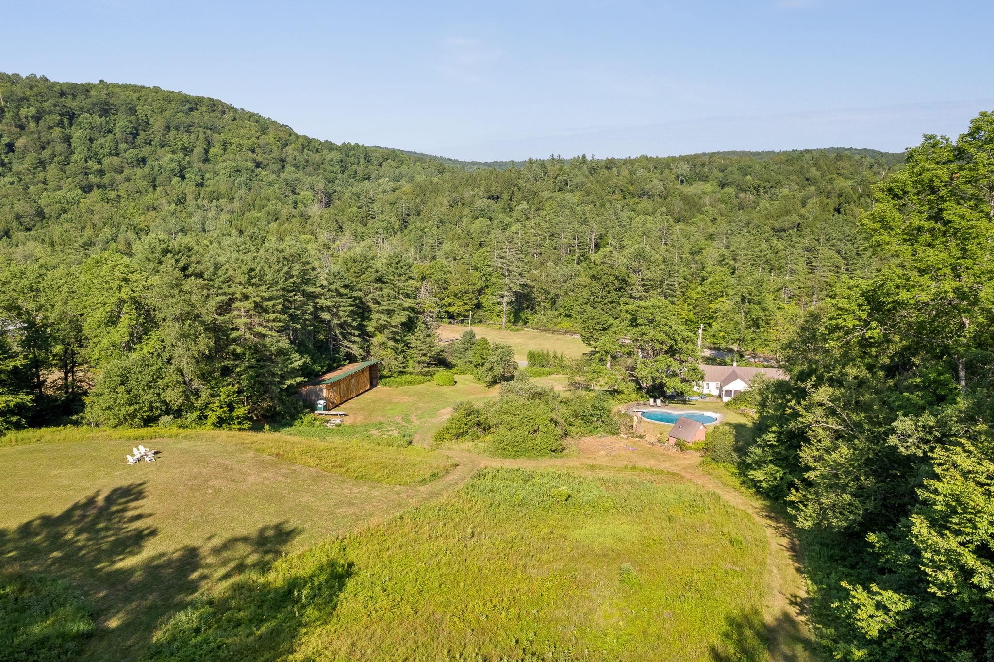 Aerial view of the home, upper fields and pool 23714447