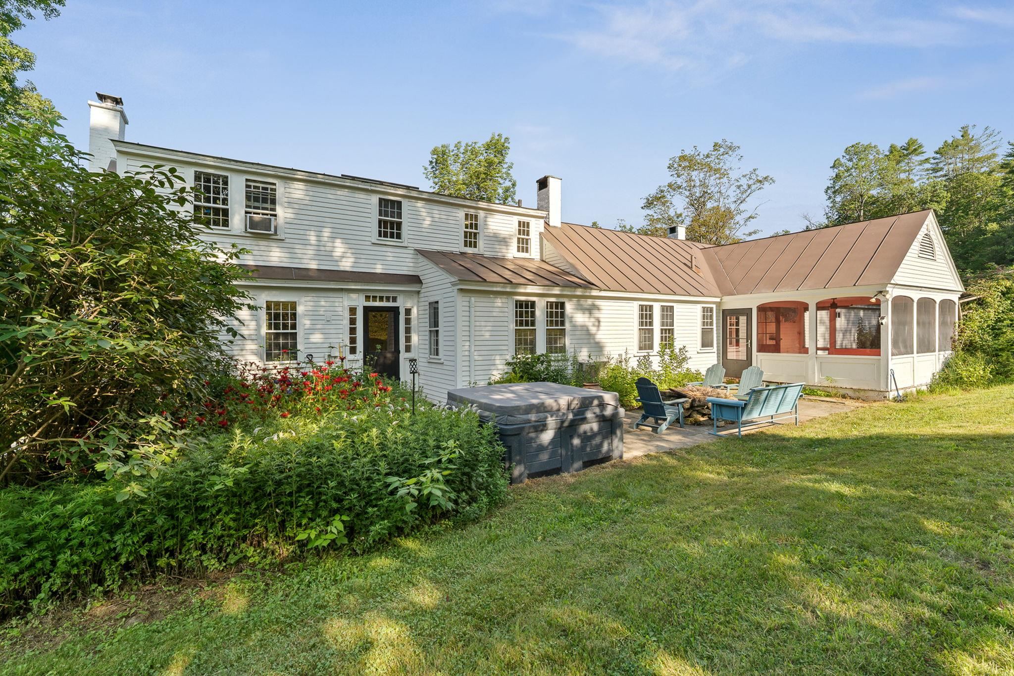 The patio includes established perennial gardens, a hot tub and fire pit area to enjoy. 23714448