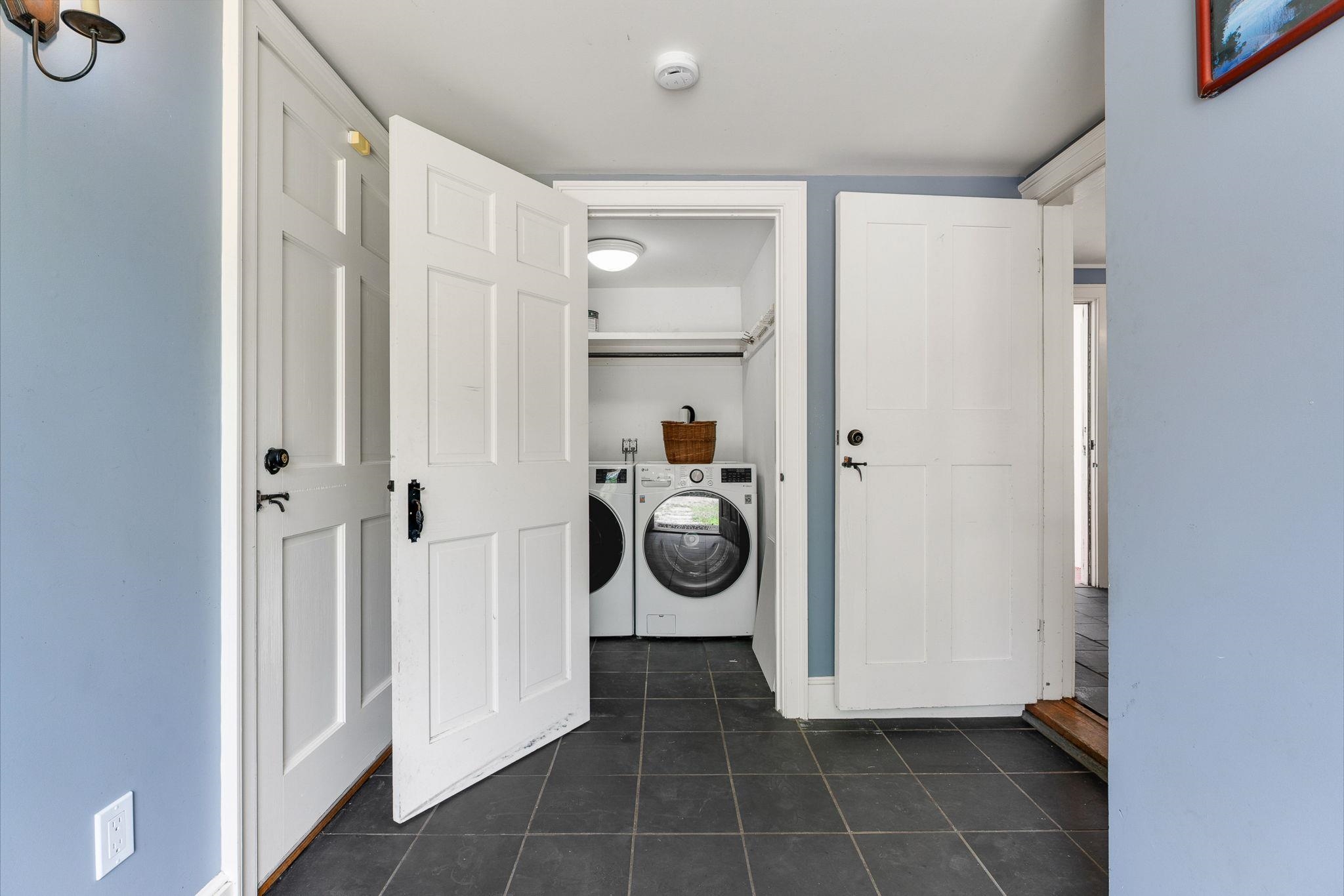 One of two laundry rooms in the home. 23714453