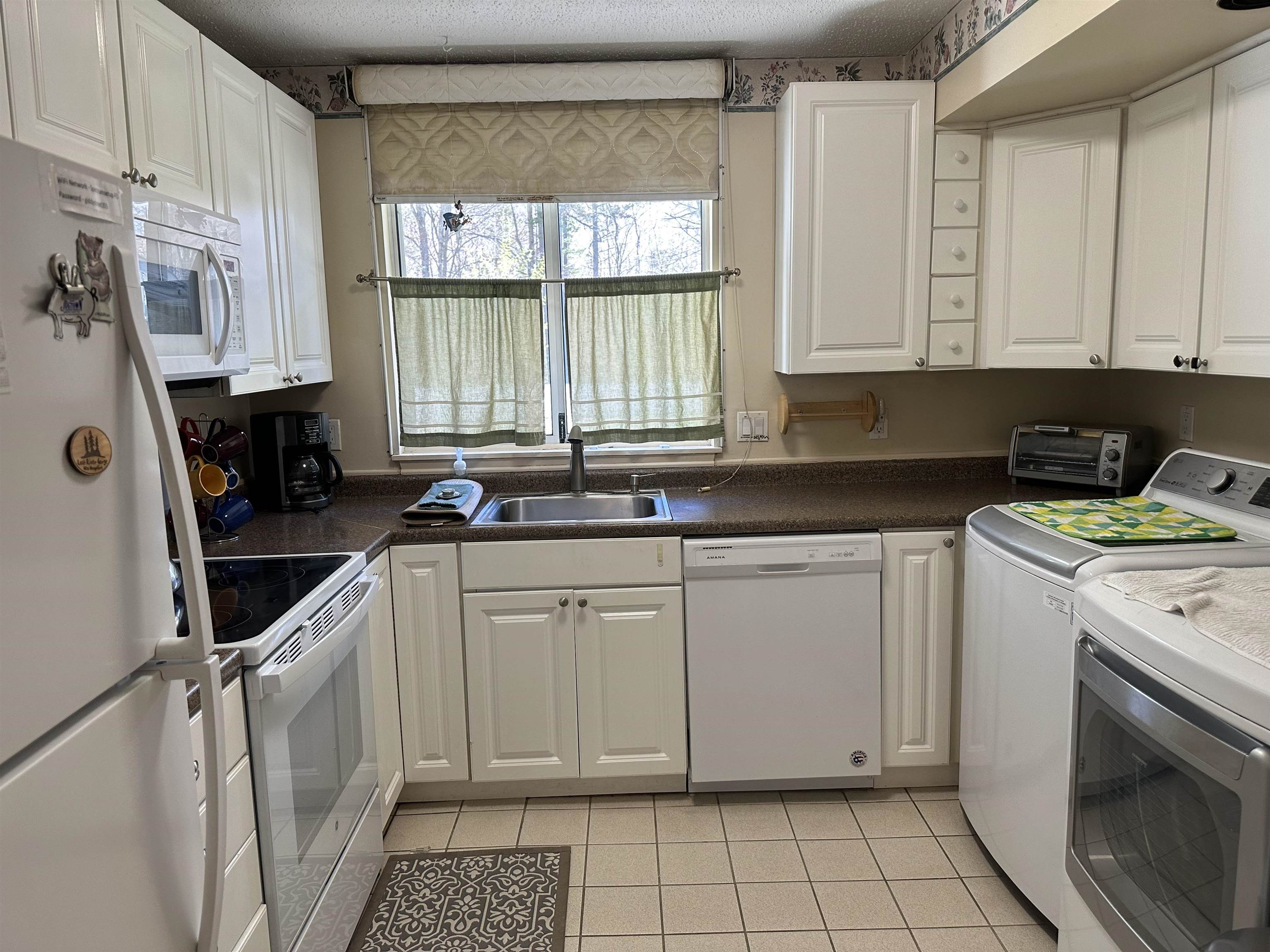 Kitchen with washer and dryer