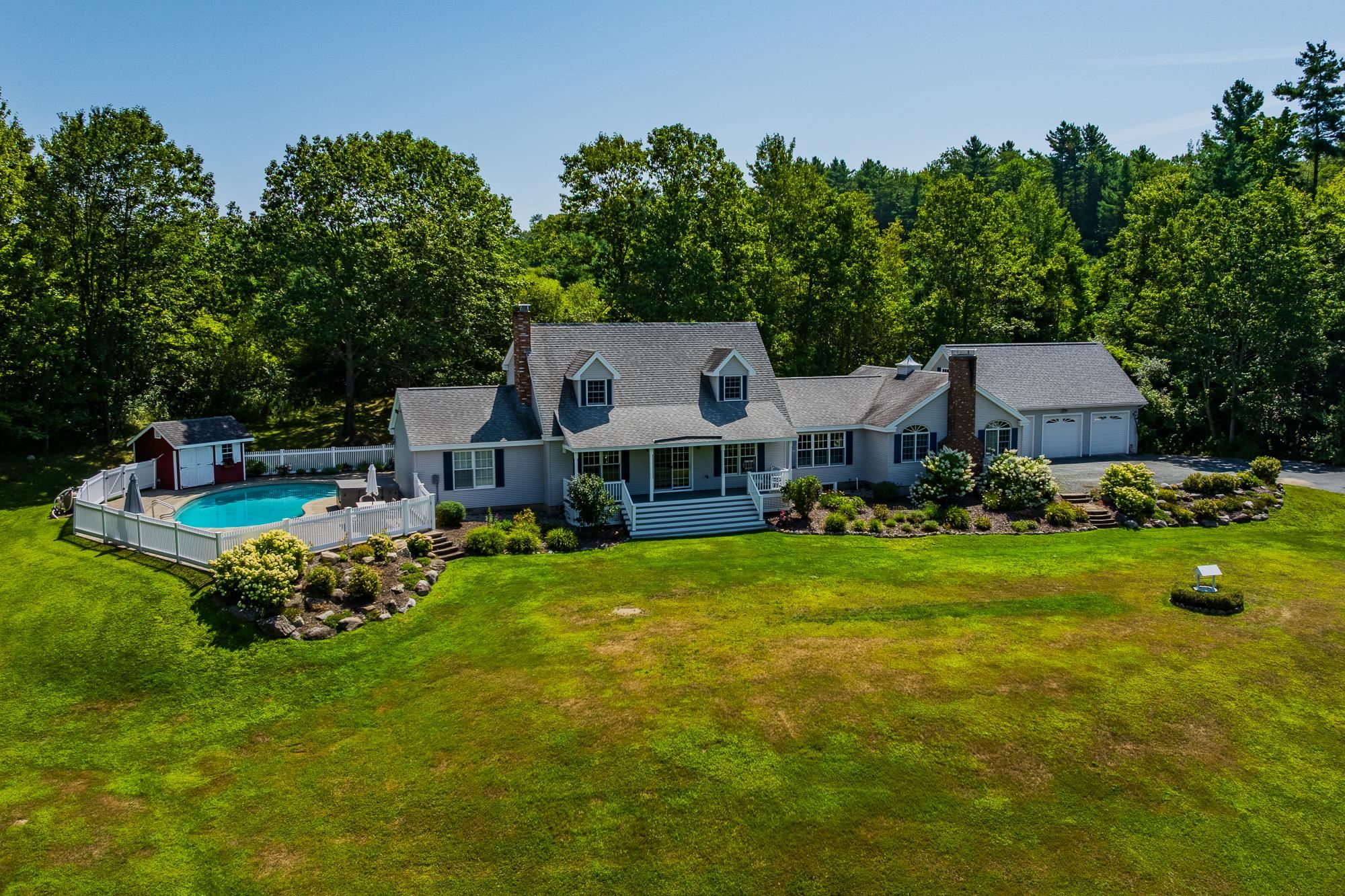 In ground pool accessed from screened porch
