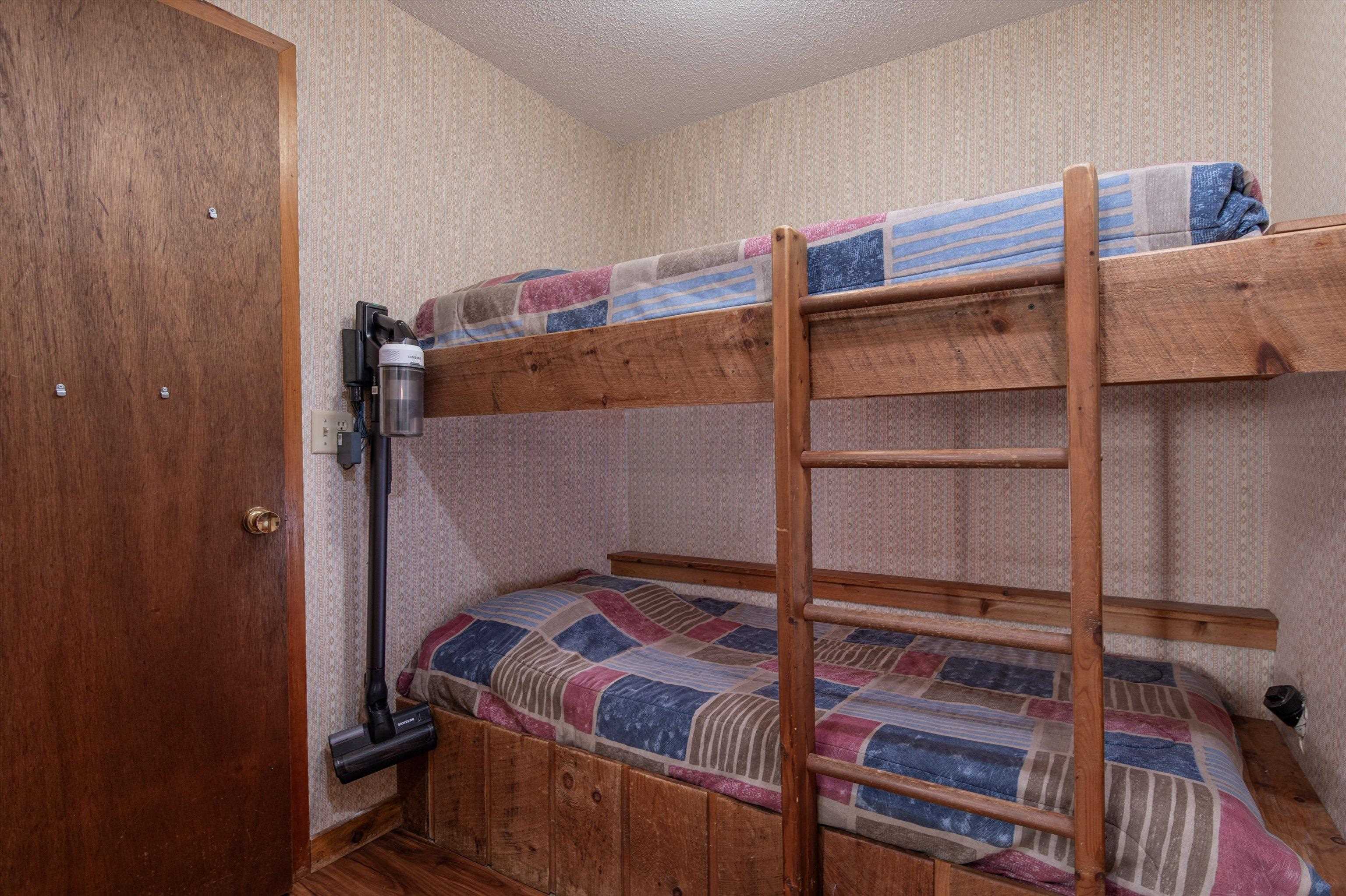Bunk room with door to W/D, mechanical room 23907063