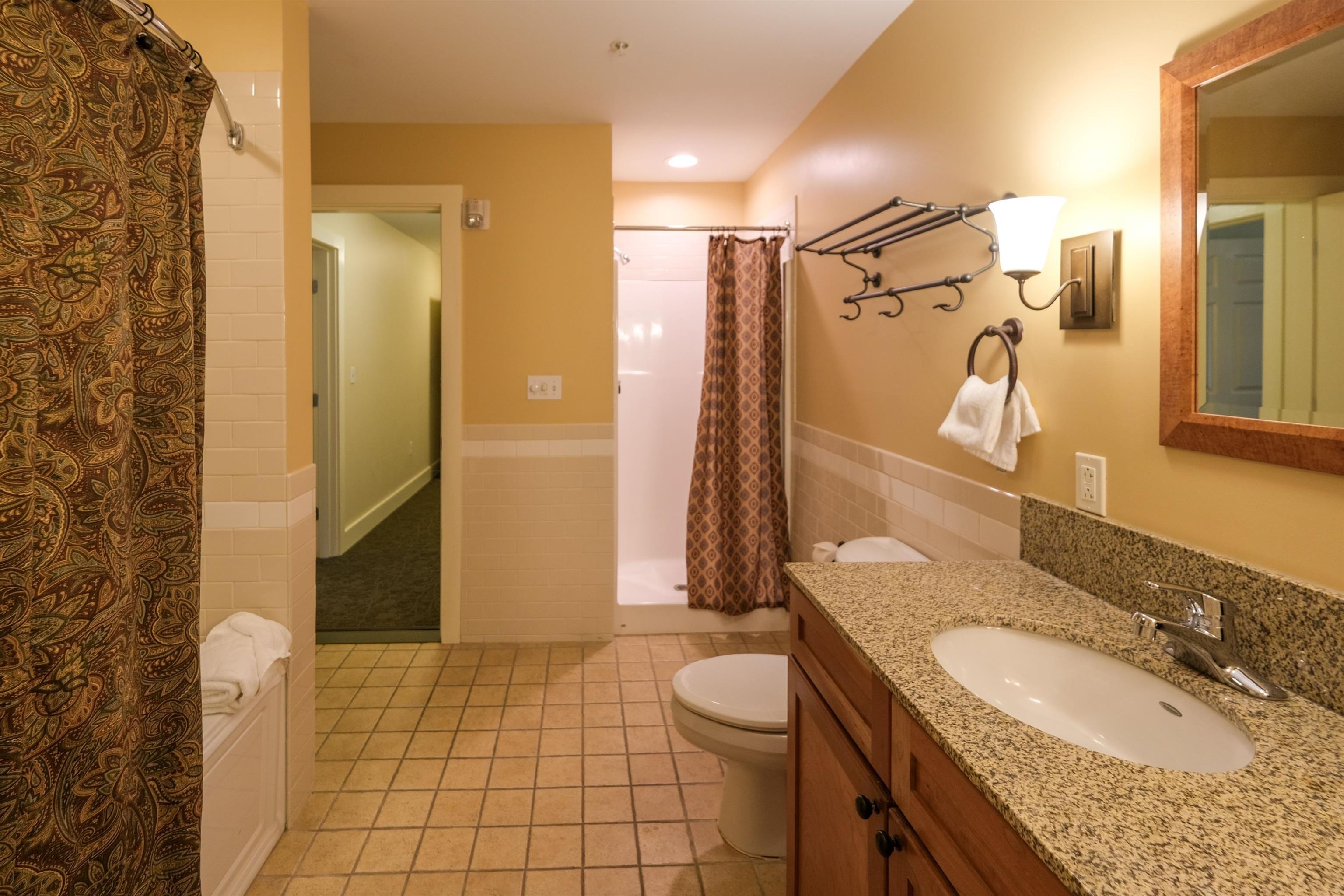 Primary bath with jetted tub and shower 23956329