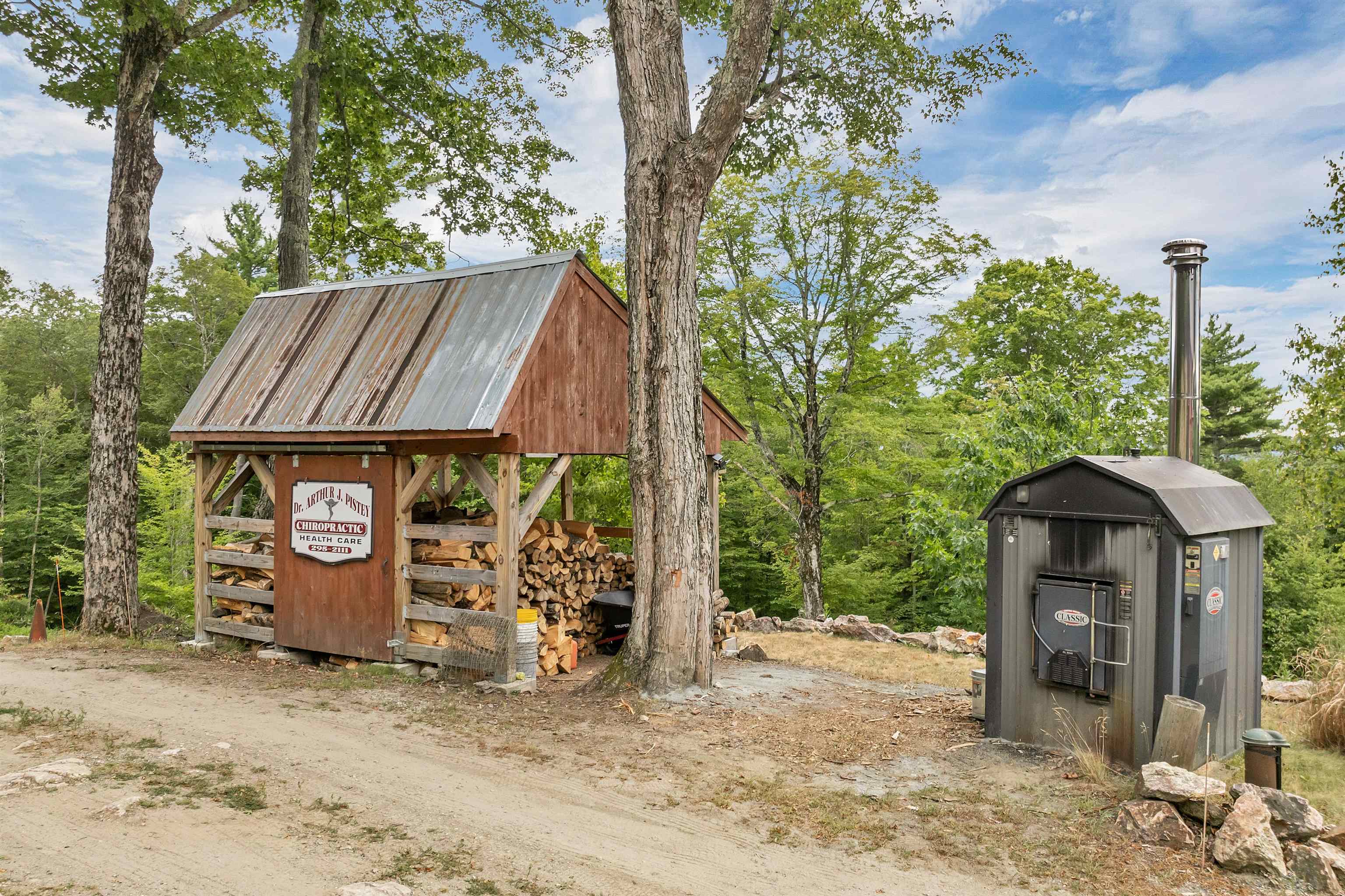 Outdoor wood boiler & wood shed stocked for winter