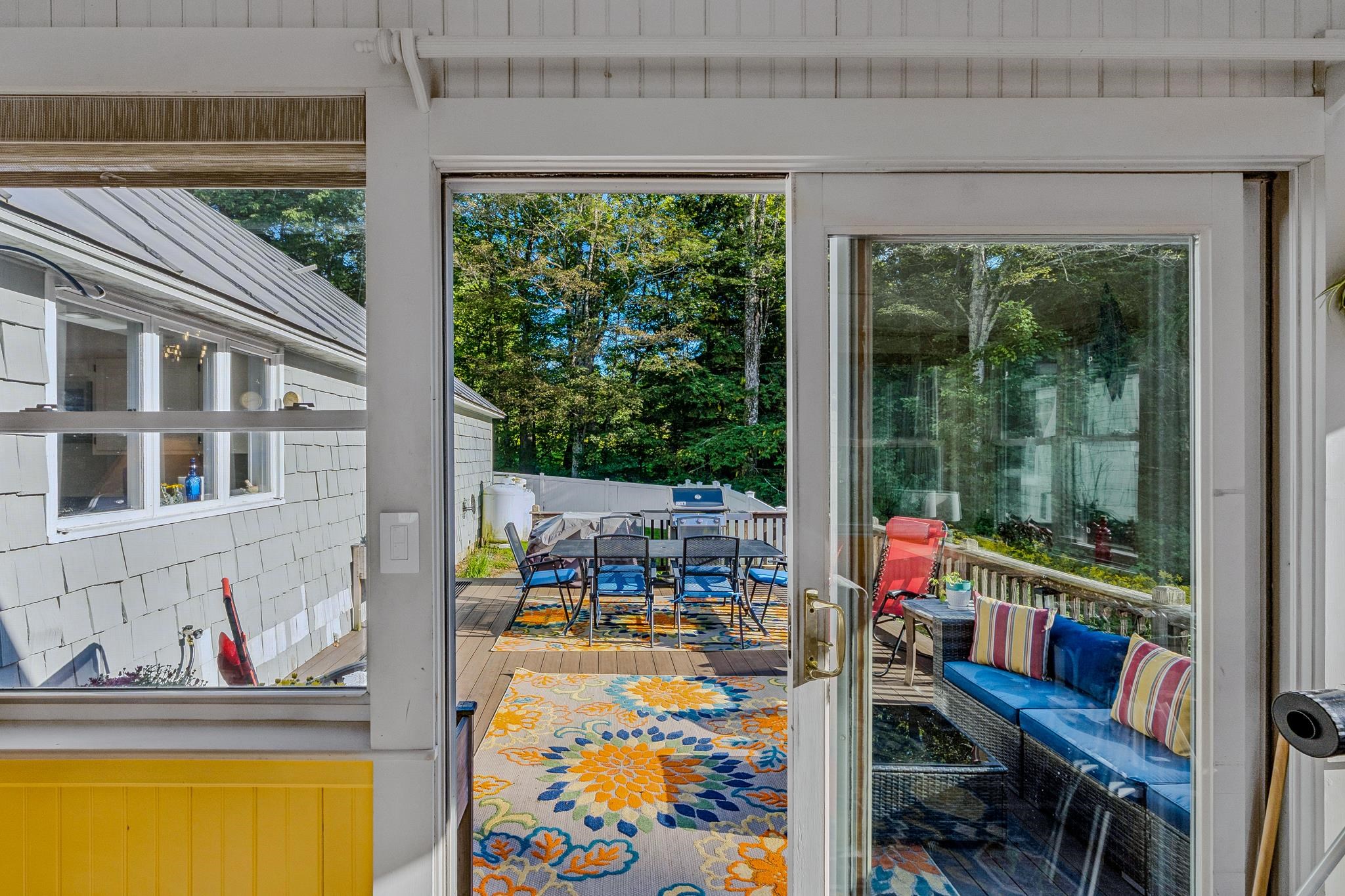 Sunroom opens to updated Deck with Lots of Room for Seating and Dining