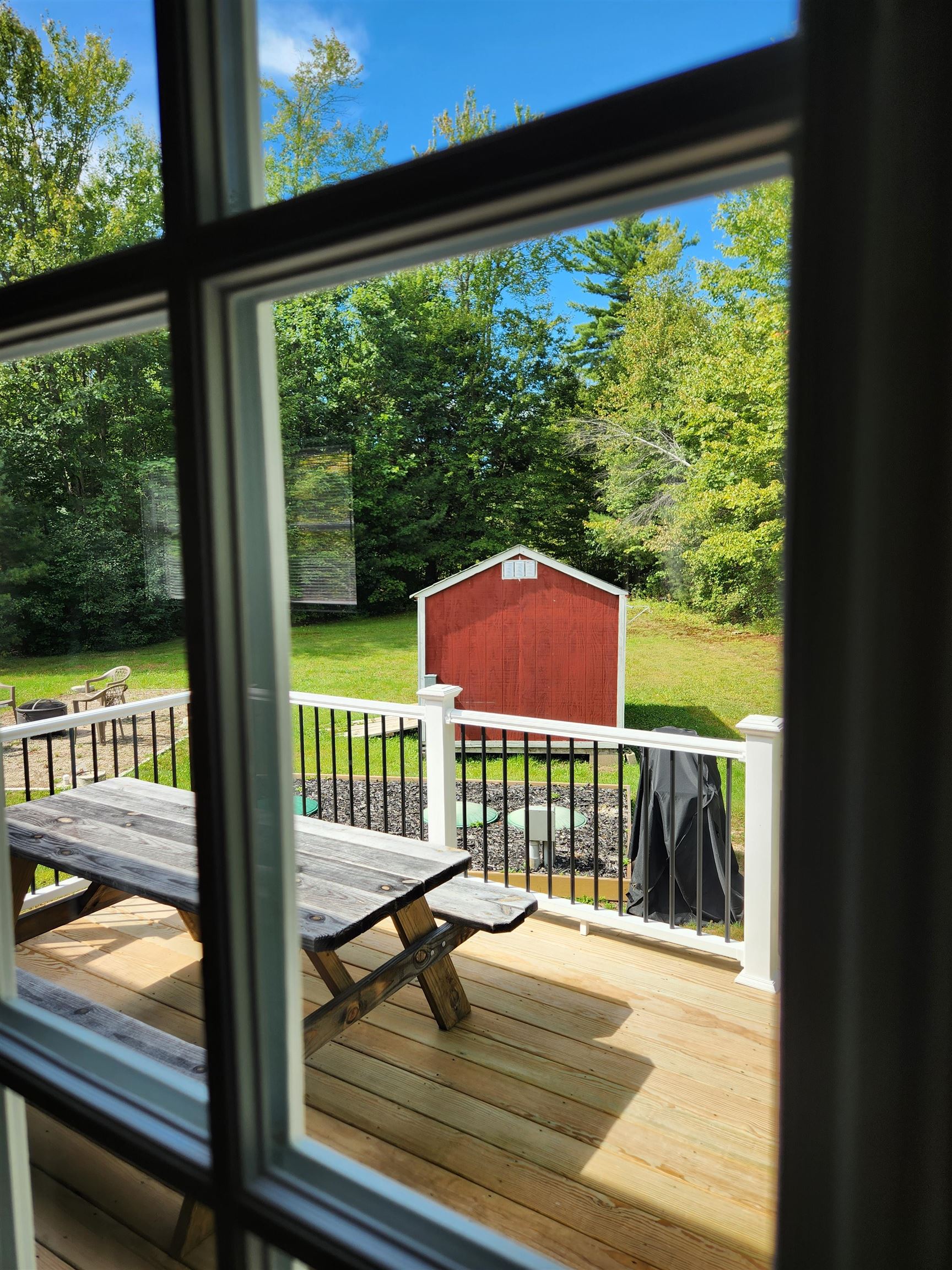 Glimpse to back deck and yard