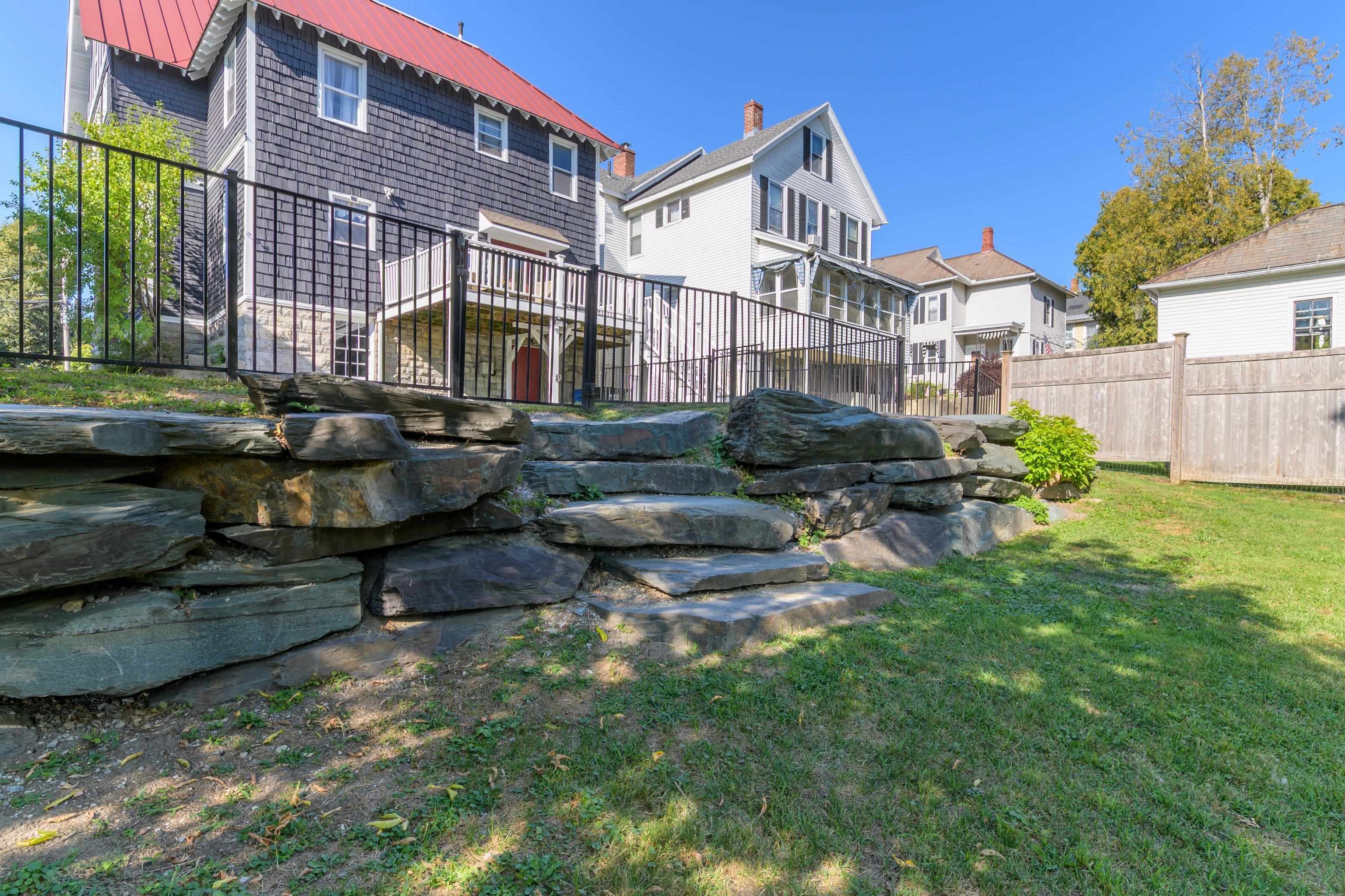 MASSIVE STONE WORK AND METAL RAILING