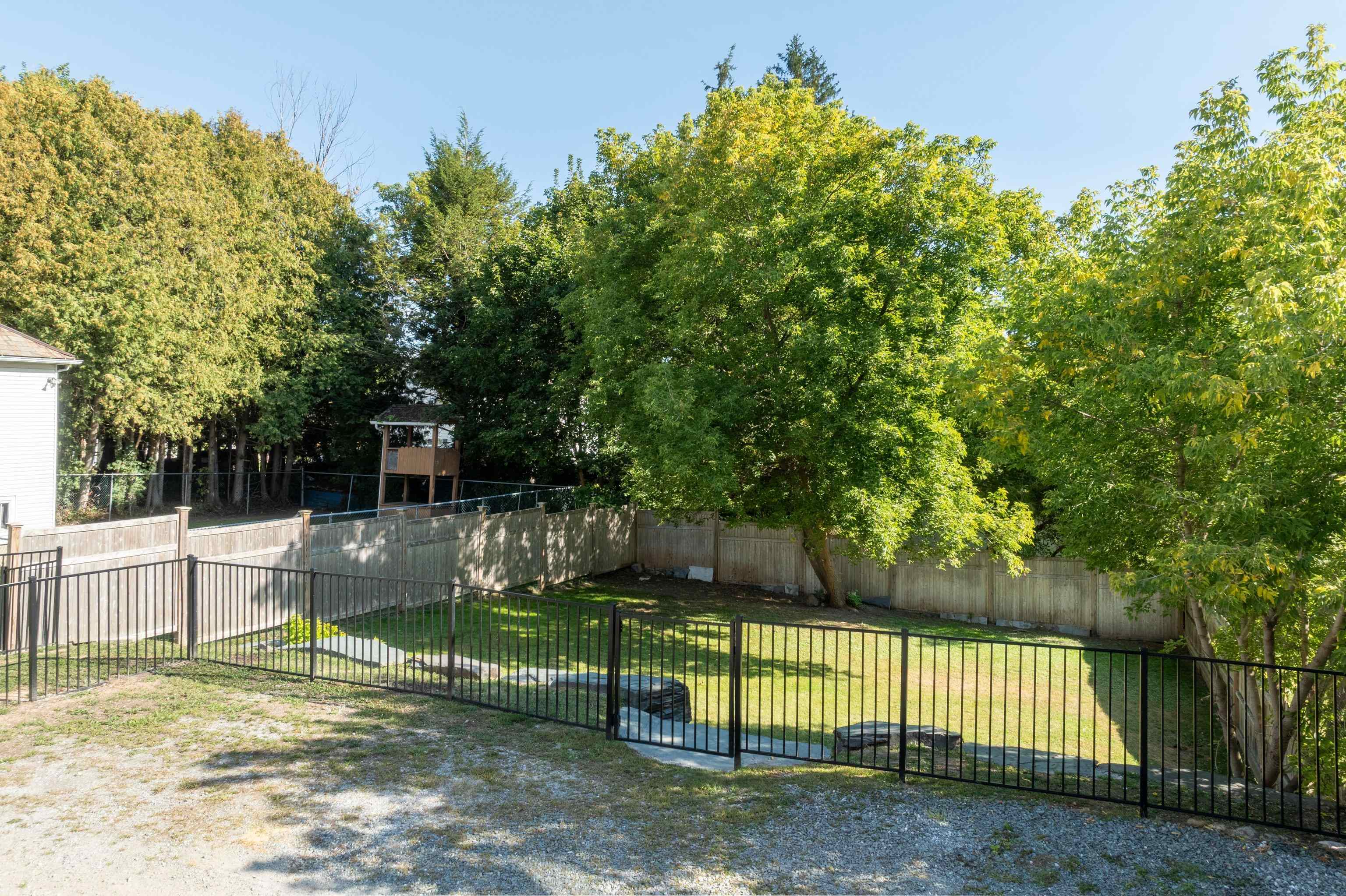 NICELY FENCED GRASSY BACK YARD