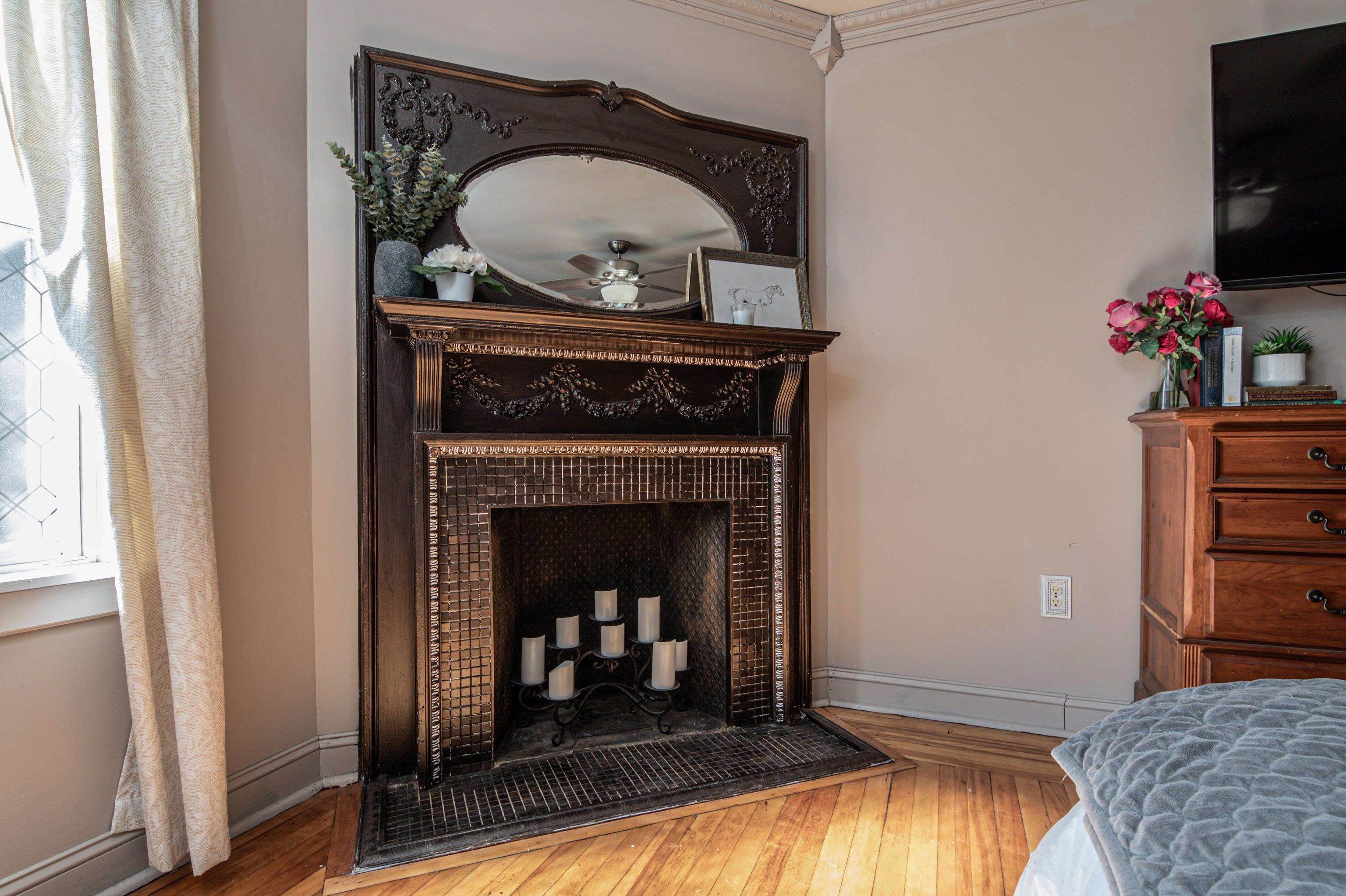 CLOSEUP OF MASTER BEDROOM FIREPLACE AND MANTLE
