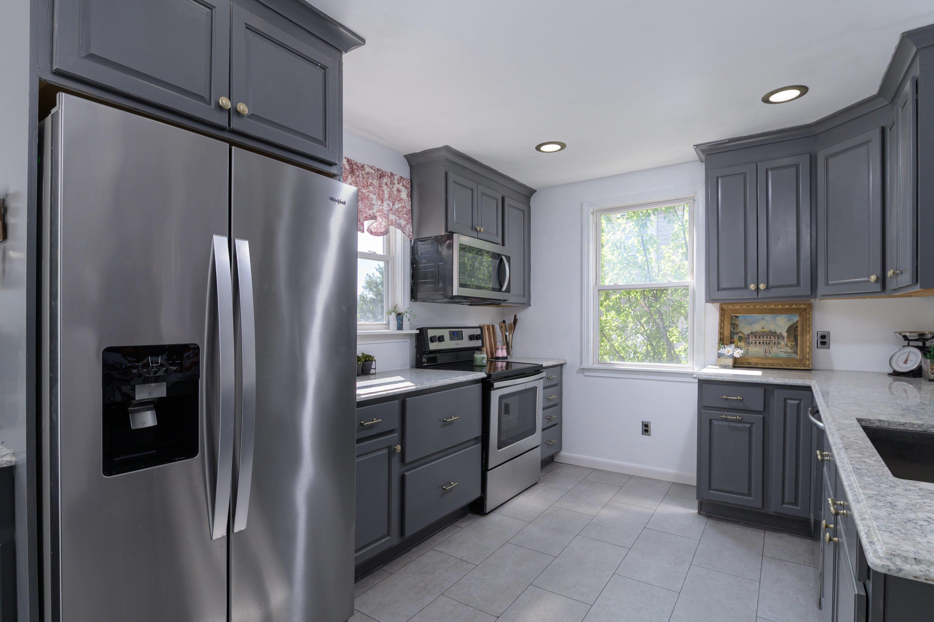 TWO WINDOWS IN WELL OUTFITTED KITCHEN