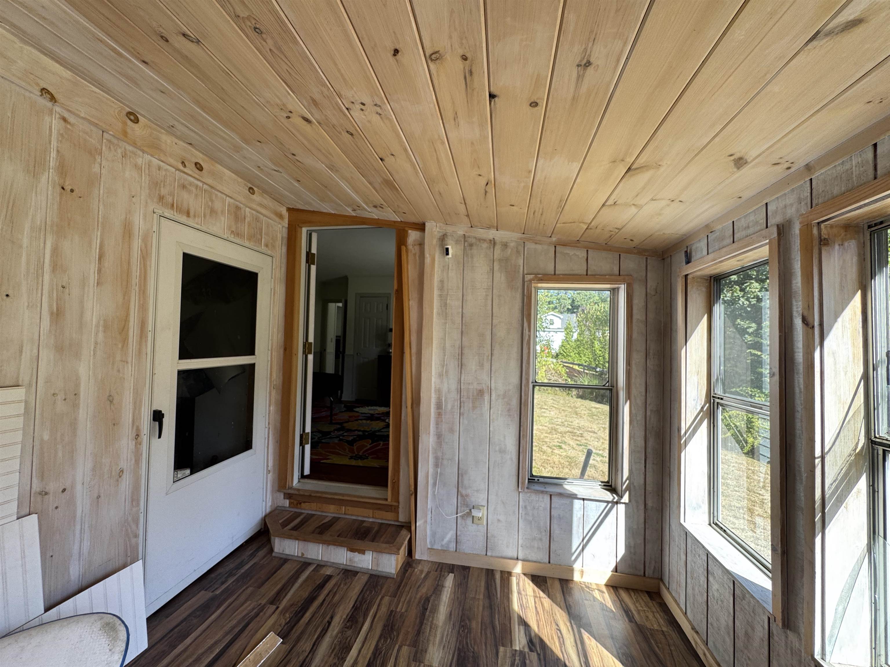 Enjoy morning coffee or evening unwinding in the homes delightful sunporch 24129161