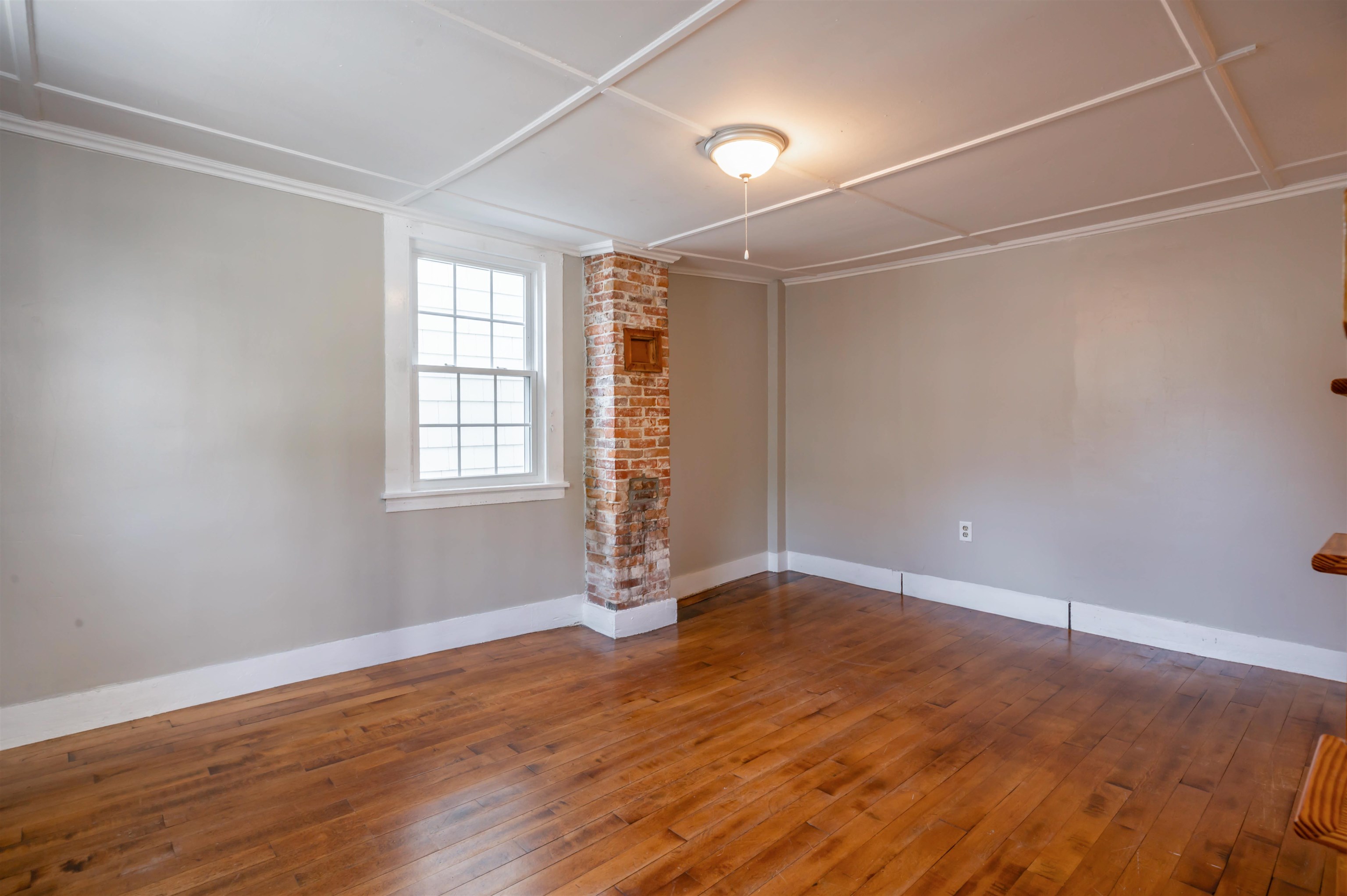 Exposed Chimney in Living Room