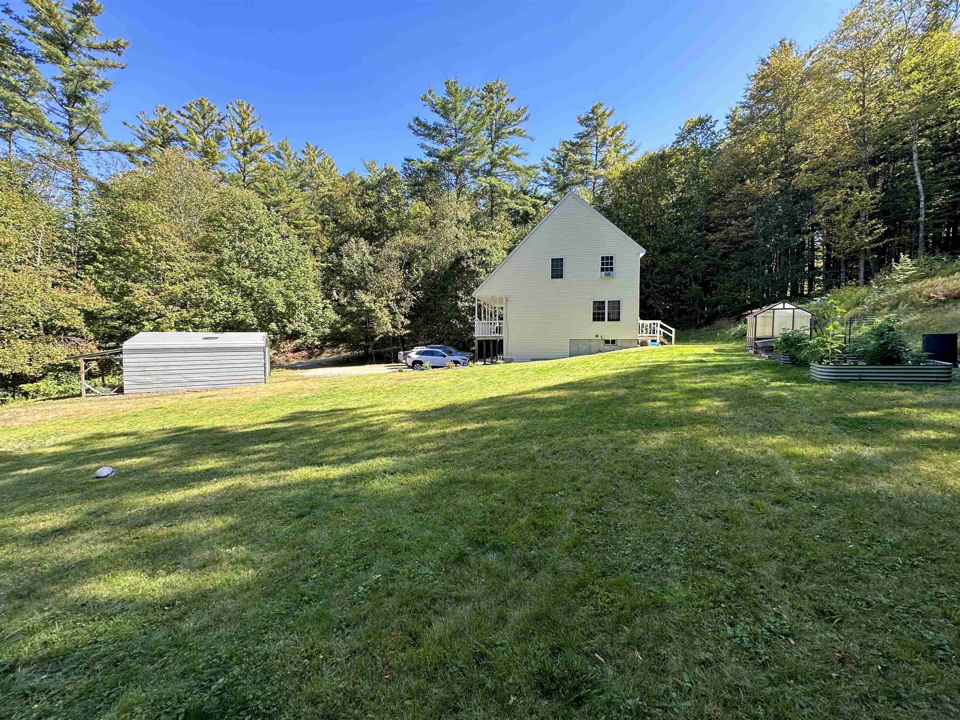 Right side yard view from natural spring pond