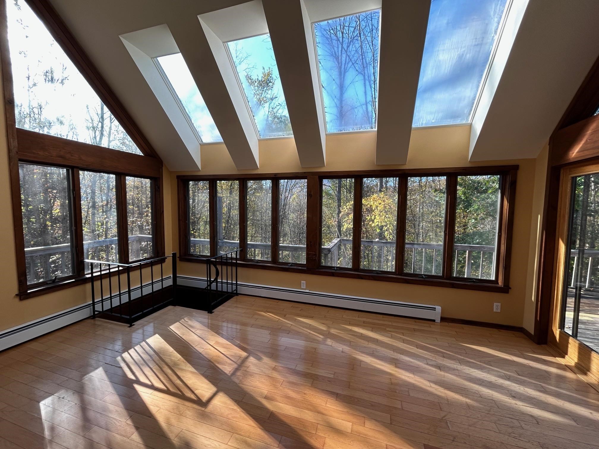 Living room window wall & skylights. 24222167