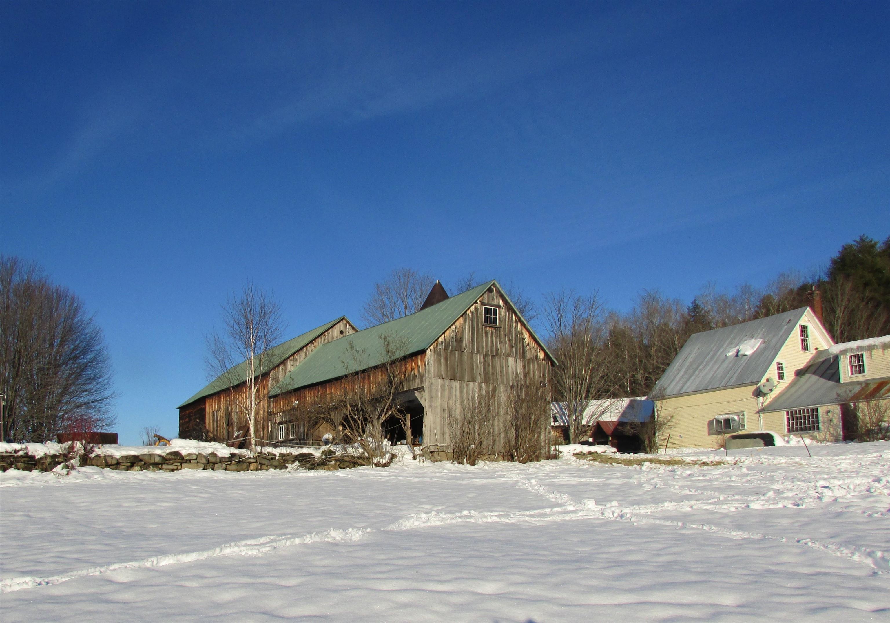 Barn and multiple outbuildings