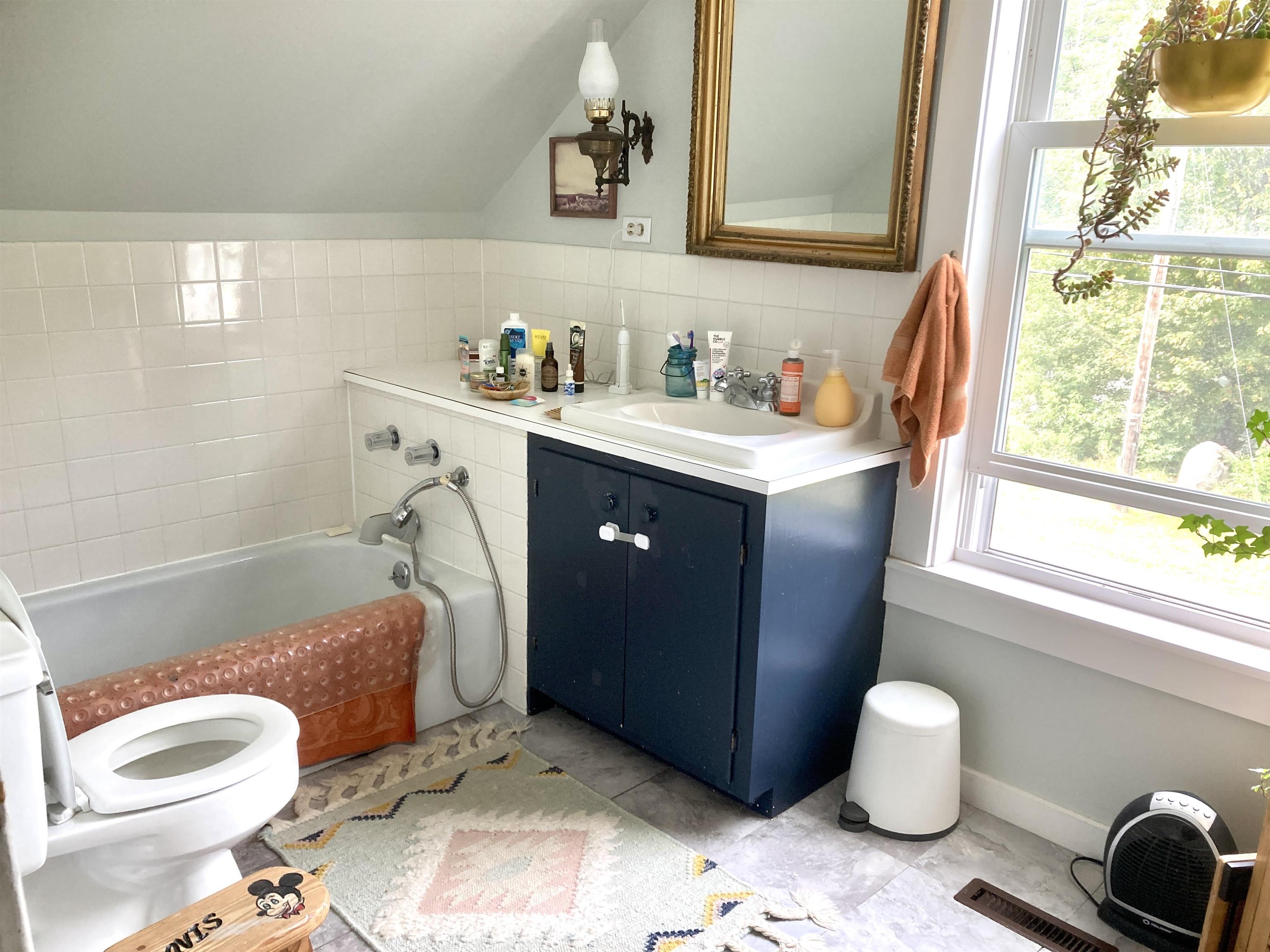 Upstairs bathroom with tub