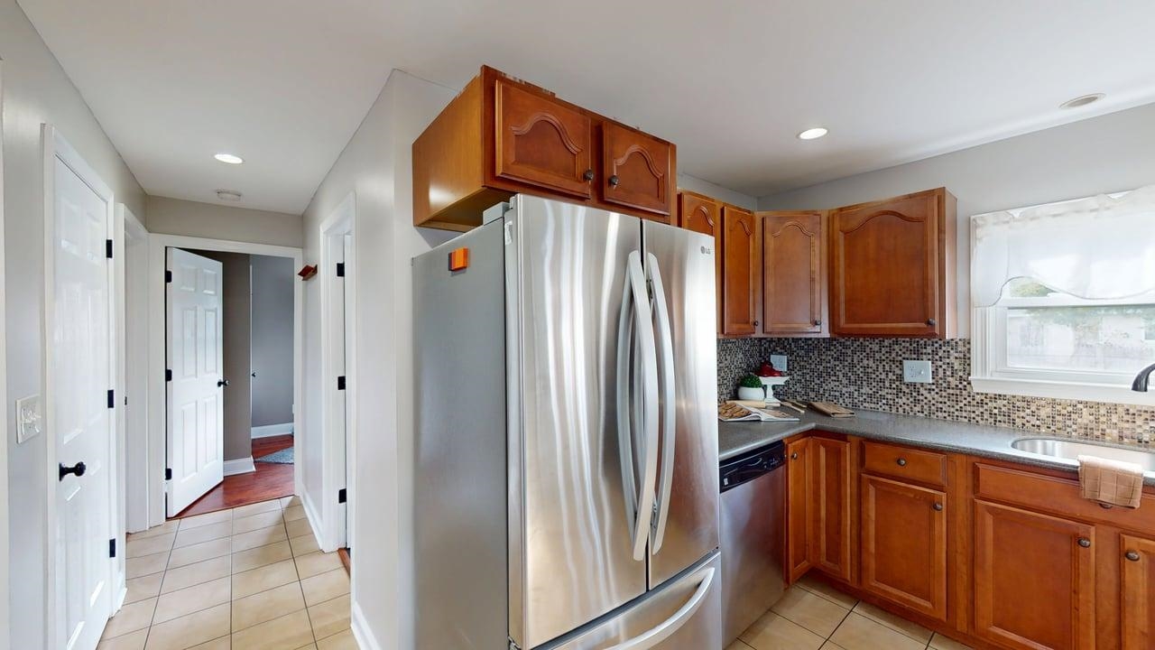 Kitchen w/Tile floor into hallway