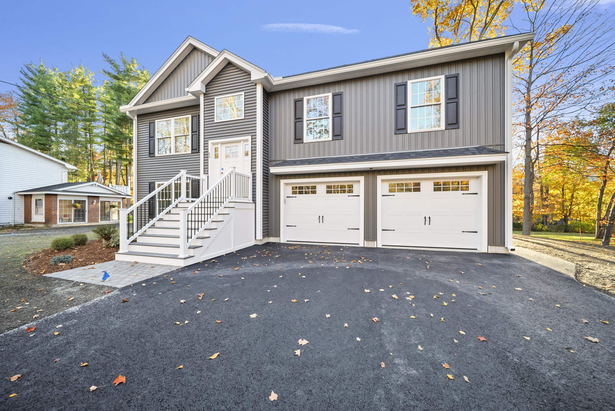 NEW CONSTRUCTION to be complete in time for the holidays! This is not the raised ranch of the 1980s! This brand-new build takes the classic design and gives it a modern, elevated twist — every square foot is above grade, thoughtfully designed, and beautifully finished. Dressed in sleek gray board-and-batten vinyl siding with full composite front stairs and a rear composite deck, this home combines timeless style with low-maintenance materials. Inside, you’ll find three bedrooms and three baths, including a primary suite with a walk-in closet and a custom tile shower.  The open-concept living room and kitchen feature a cathedral ceiling, flooding the space with light and creating that perfect airy feel. The entire top floor and staircase are finished in real white oak matte hardwood, while the walk-out lower level features LVP flooring to match for a seamless look.  The kitchen comes complete with all appliances included, and there’s still time to choose your quartz countertops with an allowance to make it truly yours. Step out from the walk-out lower level to a beautiful backyard, ready for your own finishing touches. Irrigation is included.   Location is key! This home is within walking distance to Barka Elementary and Pinkerton.  Completion expected by the end of November, just in time to settle in before the holidays!