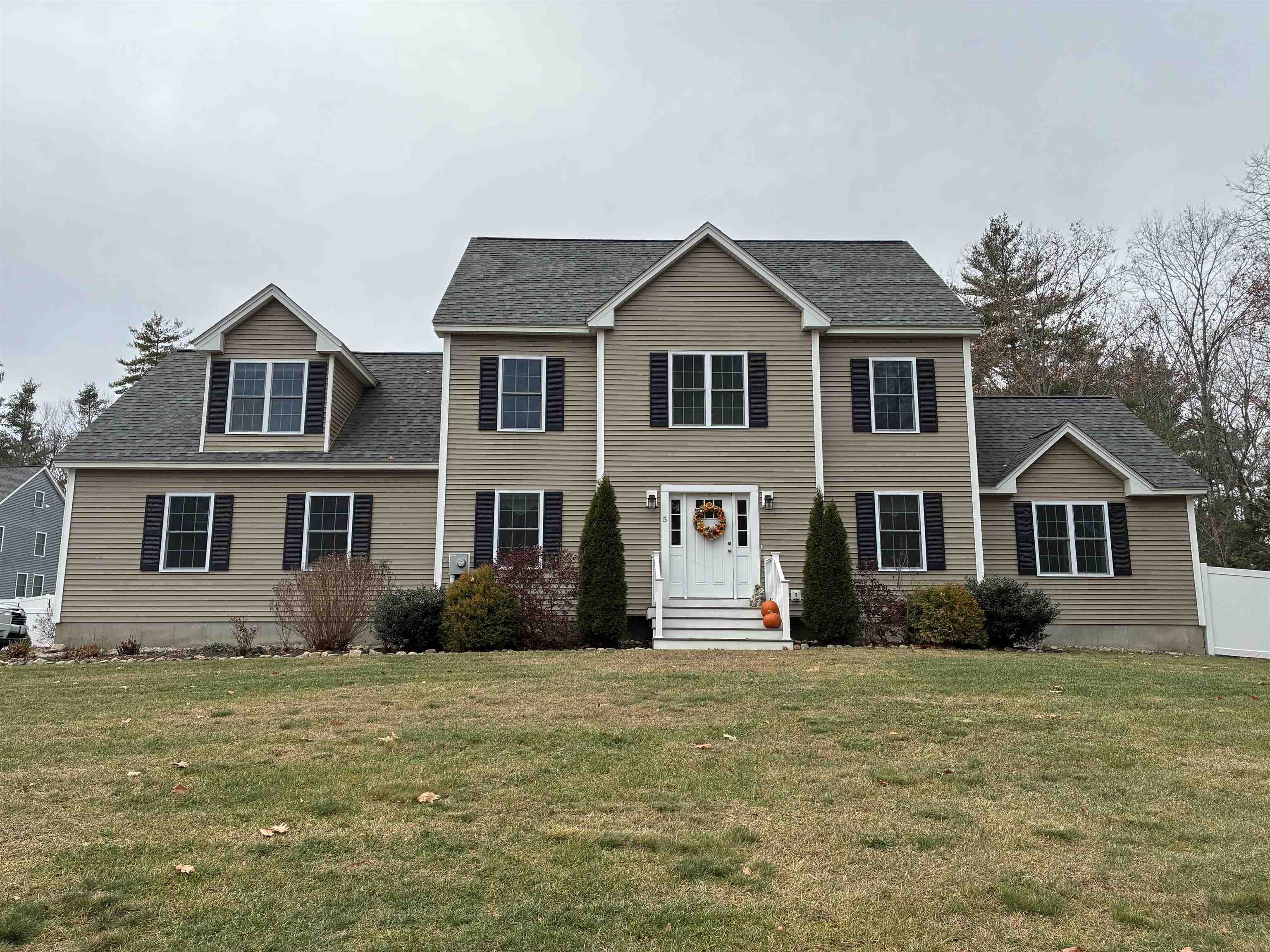 Beautiful, 4- bedroom Colonial set upon 3 acres in desirable East Derry location. Open and spacious floor plan. The kitchen offers a clean look with white cabinetry, an abundance of storage space, and stainless-steel appliances. The kitchen seamlessly flows into all surrounding rooms including the formal dining room and open back deck. The first floor features a large family room with vaulted ceiling, gas fireplace, and many windows that let in natural light. There is also a living room/office and ¾ bathroom on the first floor. Upstairs, there are 4 bedrooms including a private master suite with sitting area, 2 closets, tiled shower, and double sinks. There is also a laundry room, full bath with tub, and enormous walk- up attic. Other features include hardwood flooring throughout first floor, tile in all bathrooms, central air, generator ready hook up, granite counters in kitchen and all baths, huge and dry basement, whole house water filtration system, driveway parking for 8 cars, over 360 feet of 6 ft. privacy, vinyl fencing and 1.5 acres of completely cleared land perfect for all your gardening and homestead dreams.